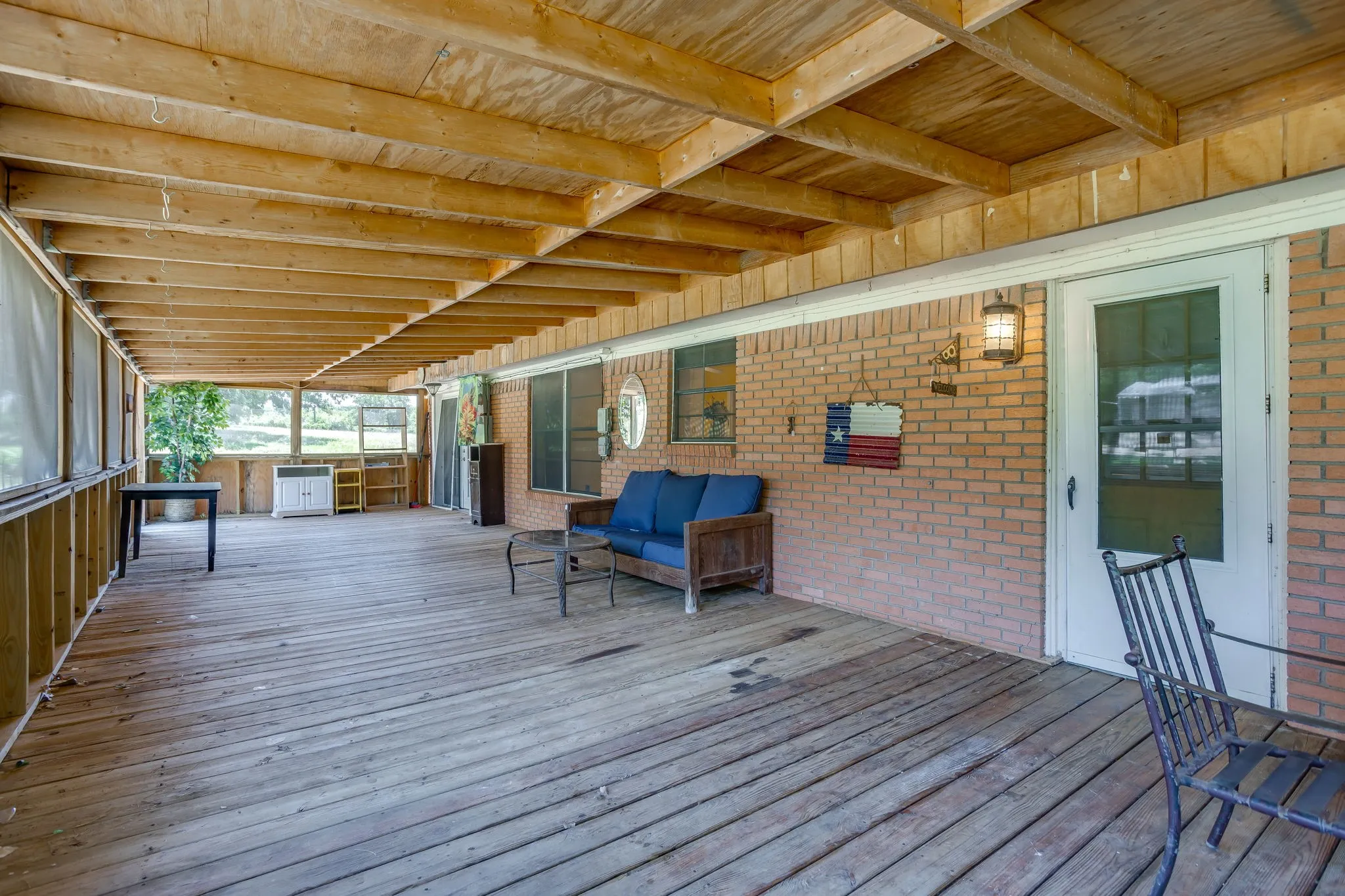 Screened back patio- door out of kitchen