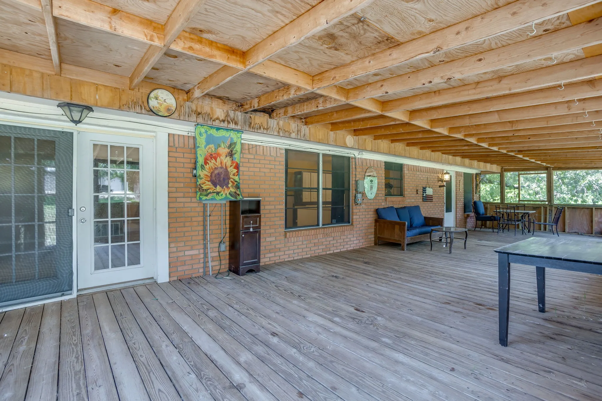 screened back patio- French doors out of Primary Bedroom.