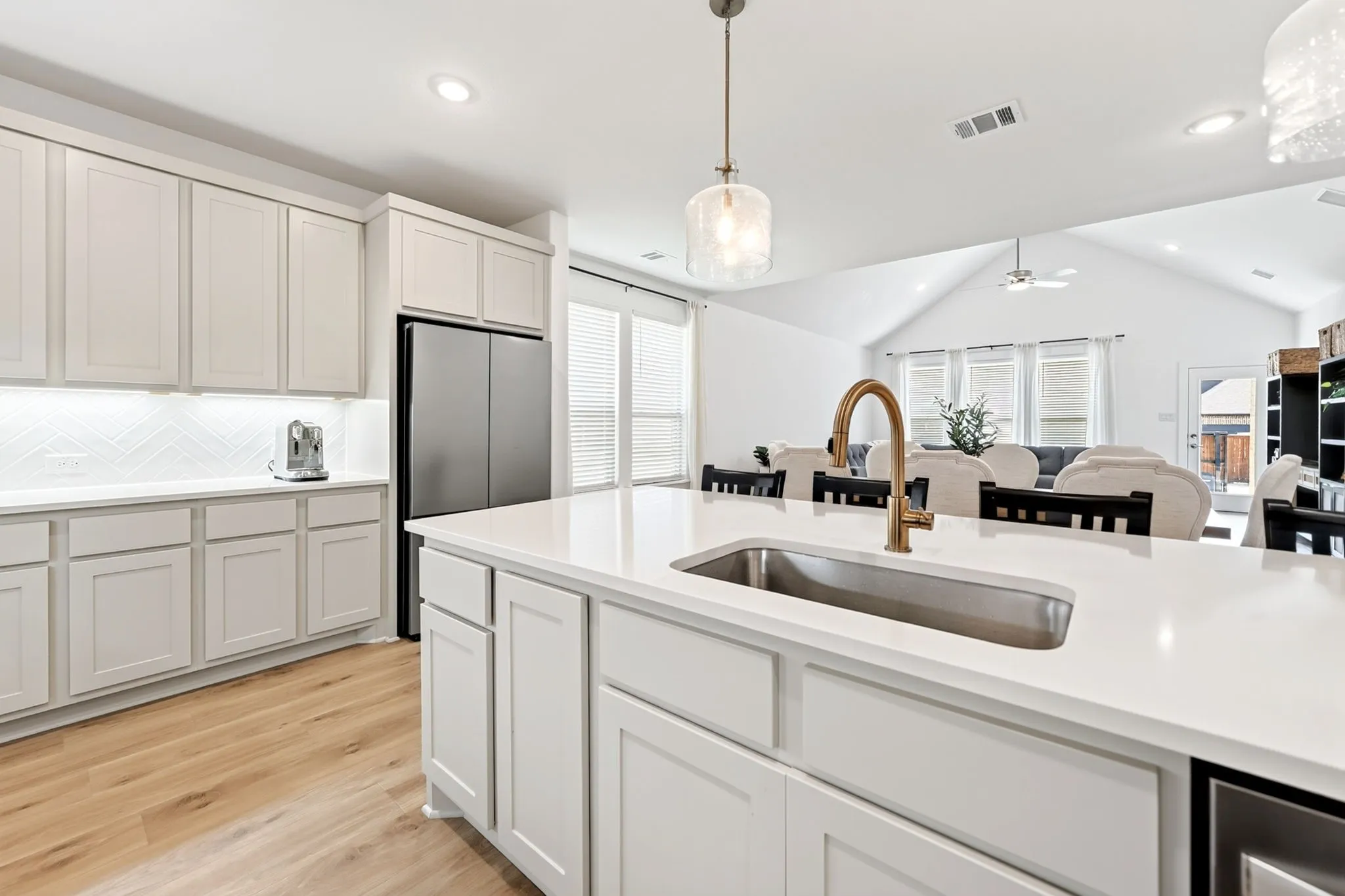 Kitchen island with an undermount sink and gooseneck faucet