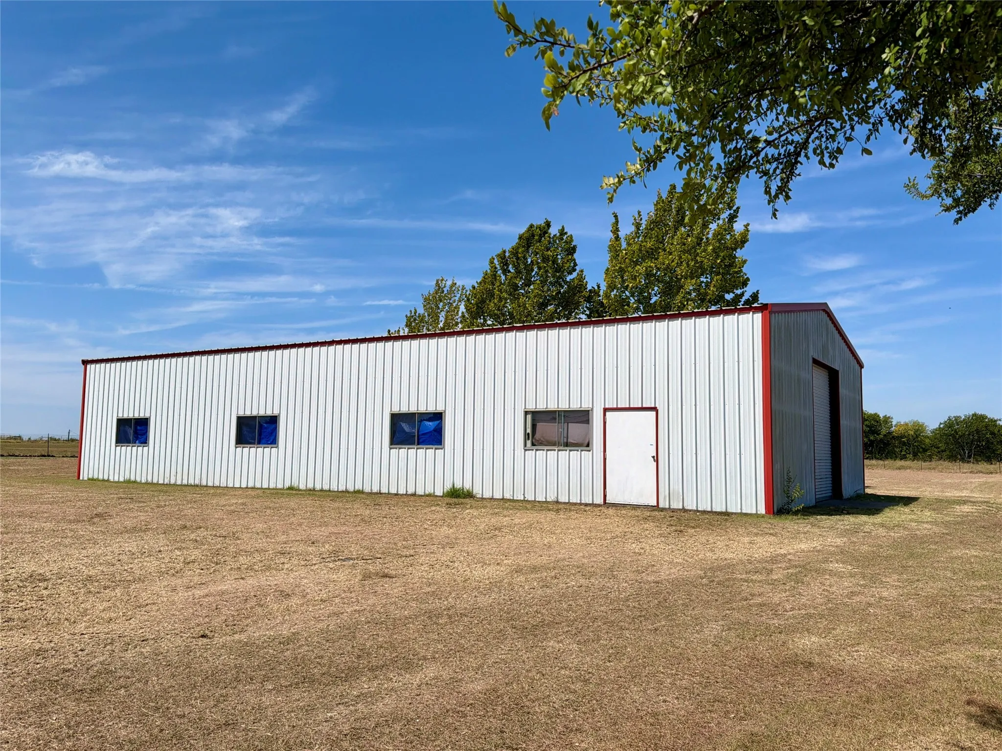 40x80 shop, concrete flooring, insulated, water & electric