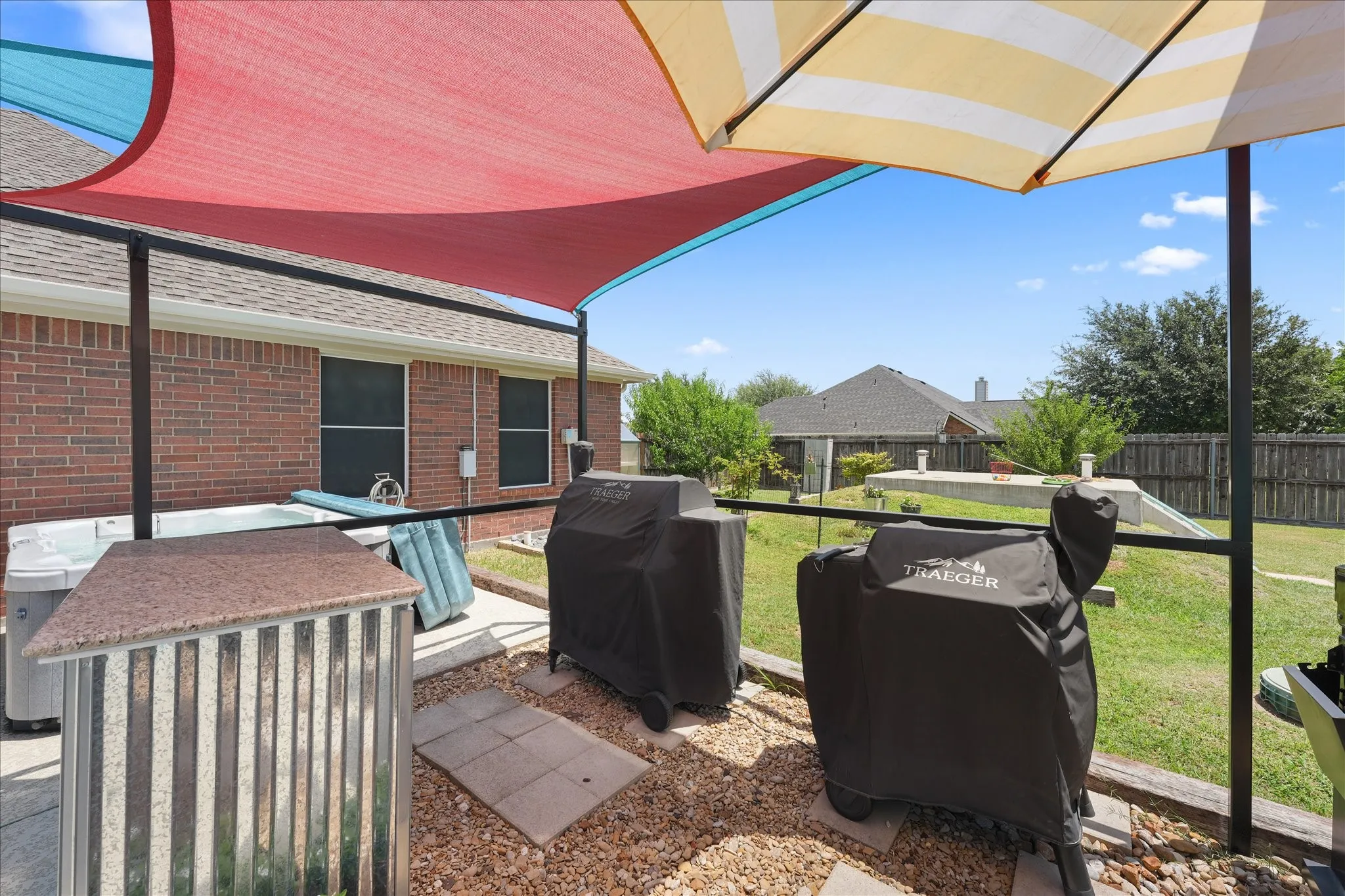 Outdoor cooking area, hot tub and walk-in storm shelter