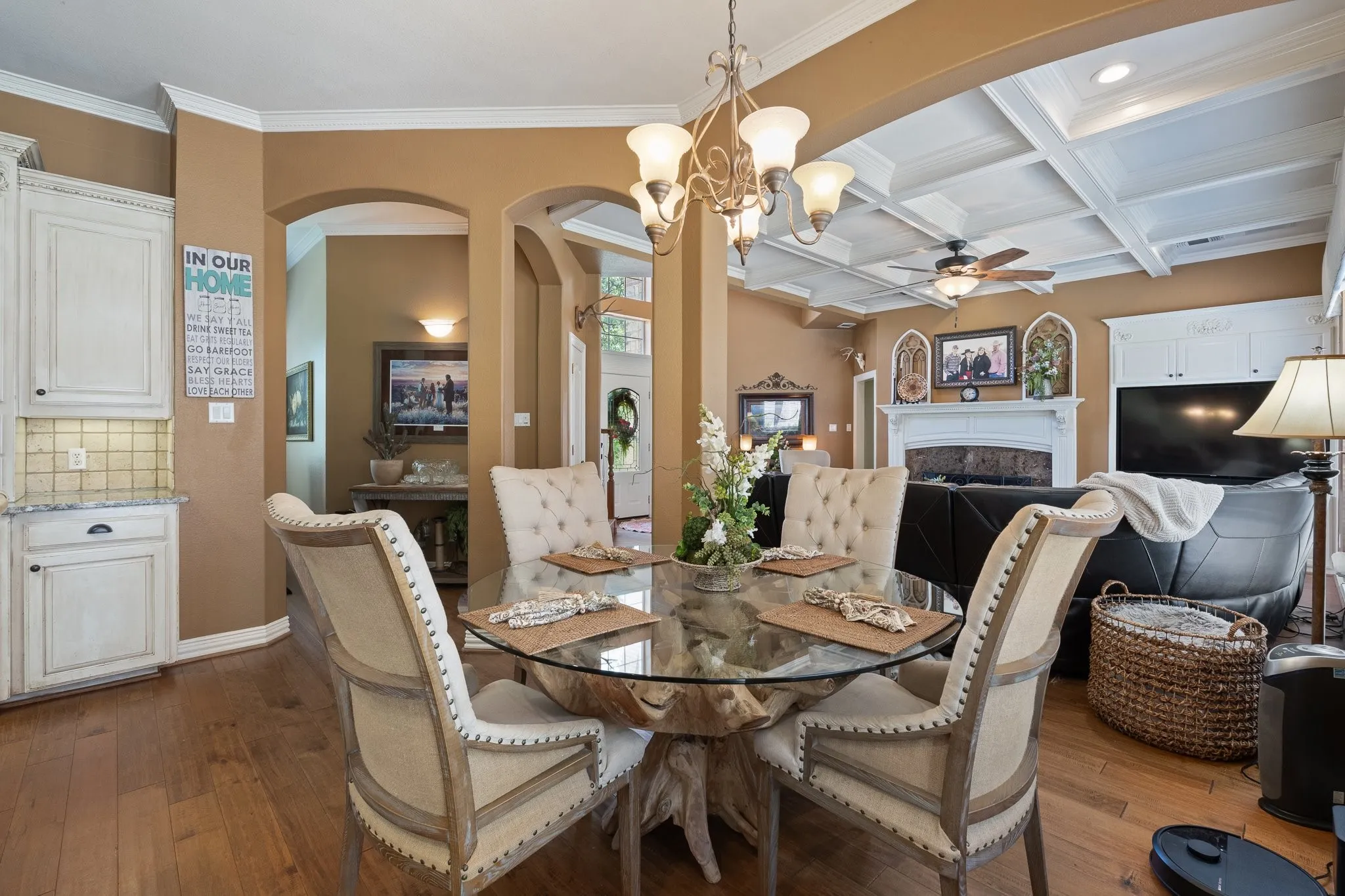 Hardwood-style flooring throughout, archways and open space