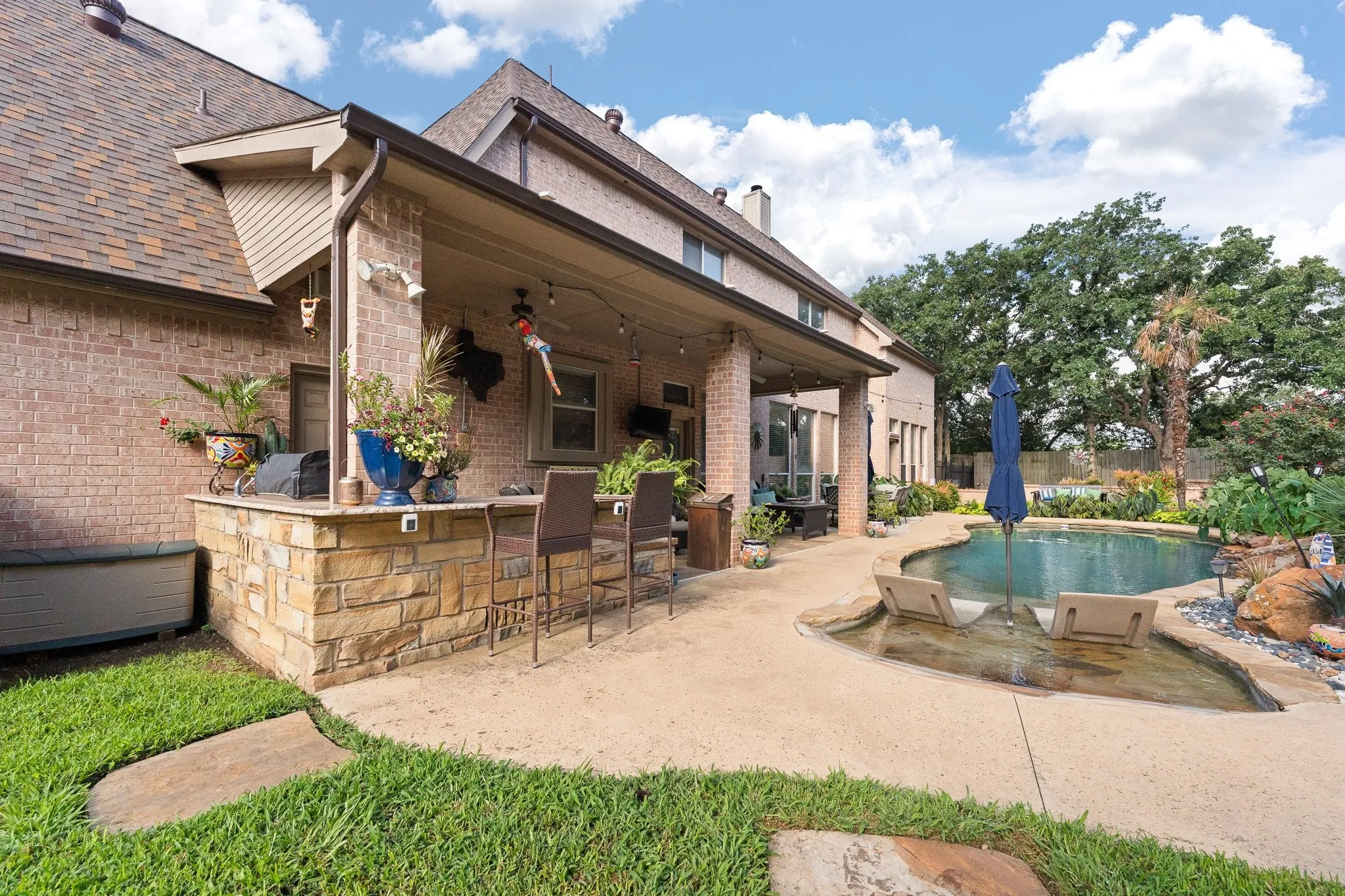 Outdoor kitchen area so you can grill as you chill!