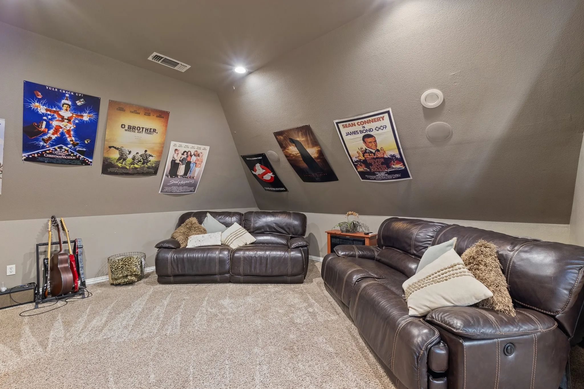 Spacious bonus room featuring sloped ceilings, recessed lighting, and integrated ceiling speakers