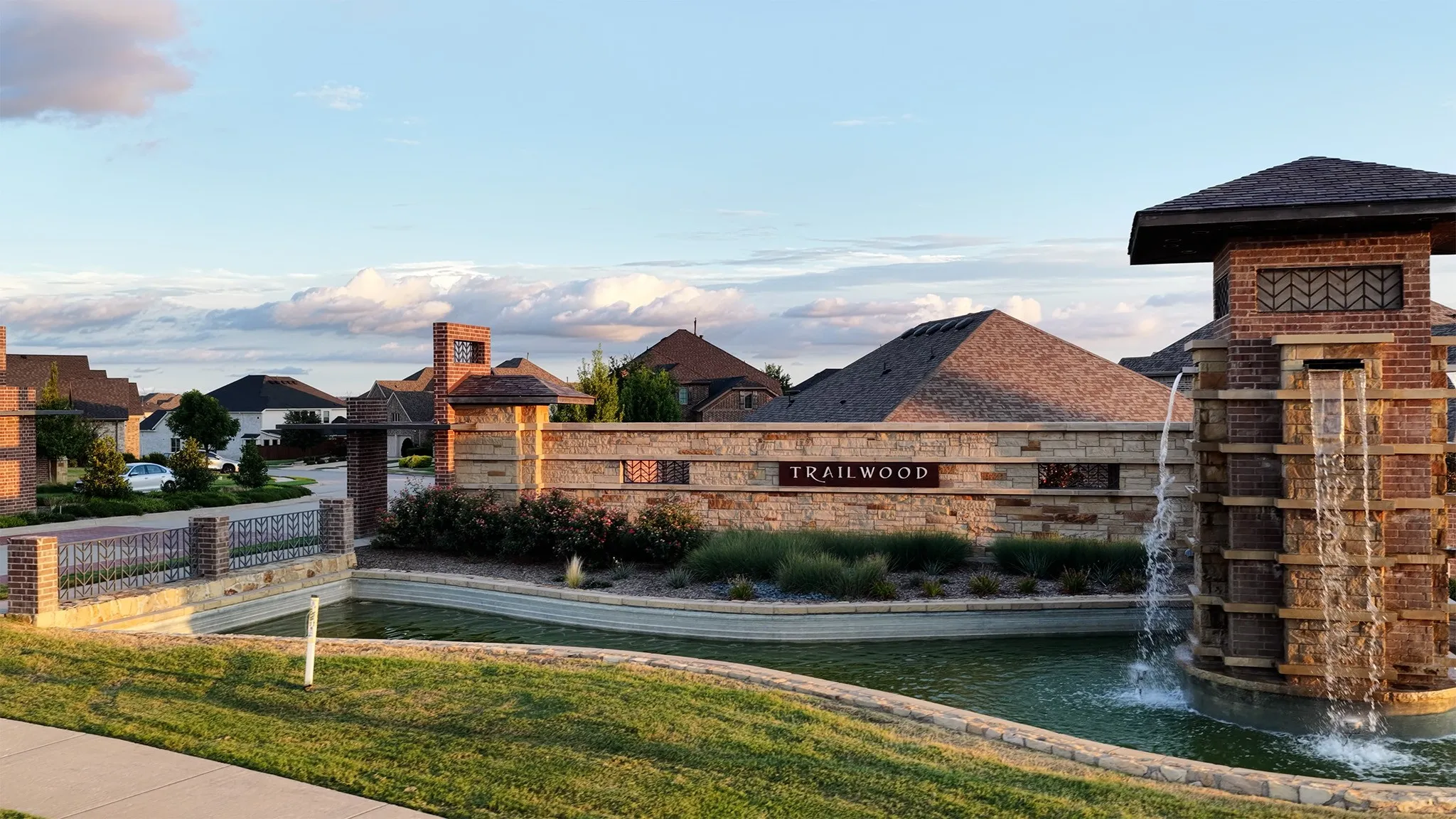 Community entrance showcasing beautiful water feature.