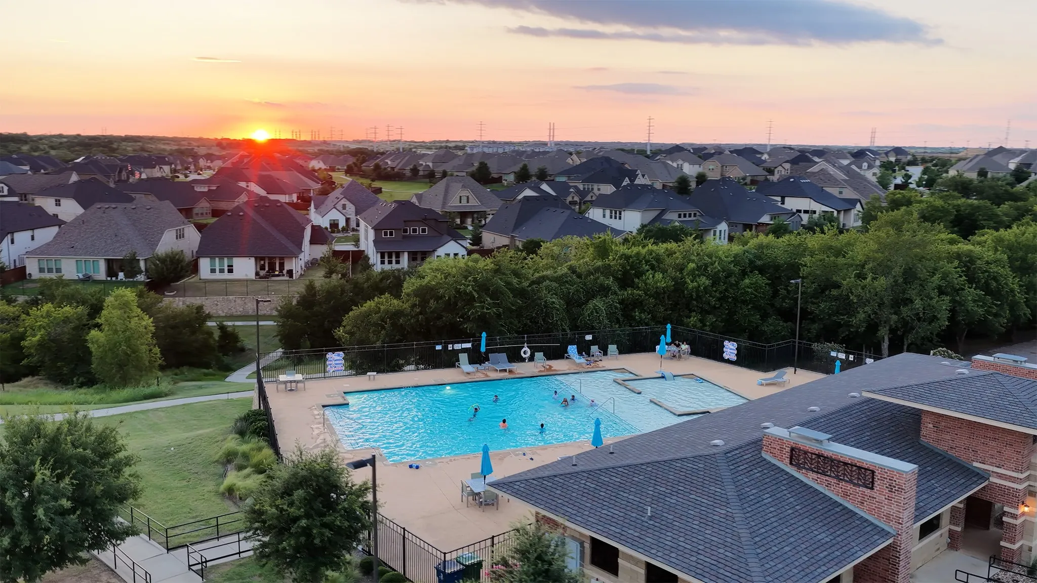 Community pool with views overlooking greenspace, homes, and trail access.