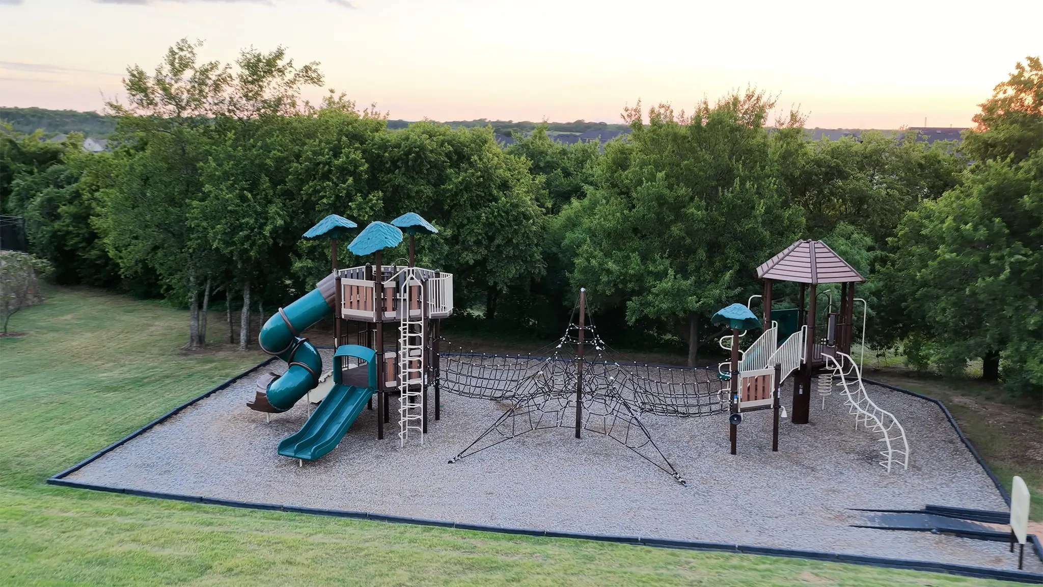 Outdoor playground by the community pool.
