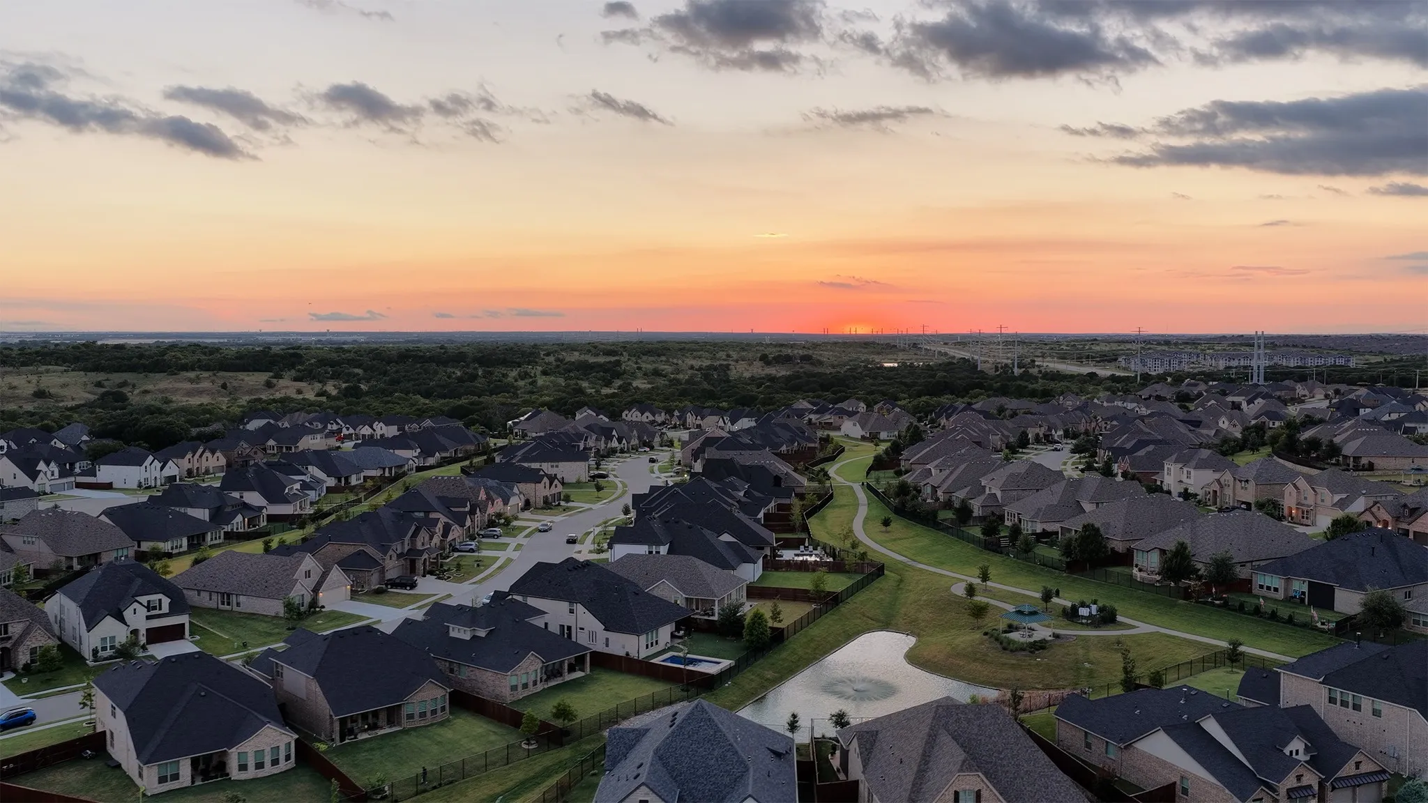 Aerial view of neighborhood at sunset.