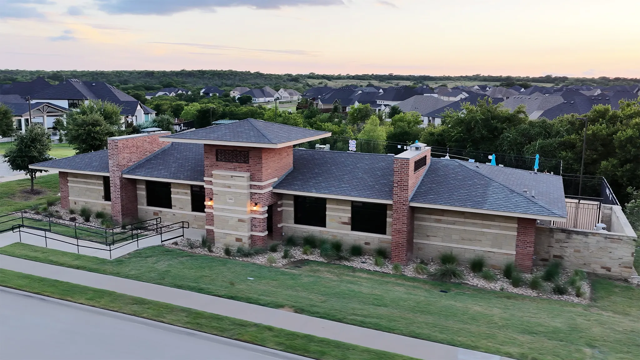 Community clubhouse next to neighborhood pool.