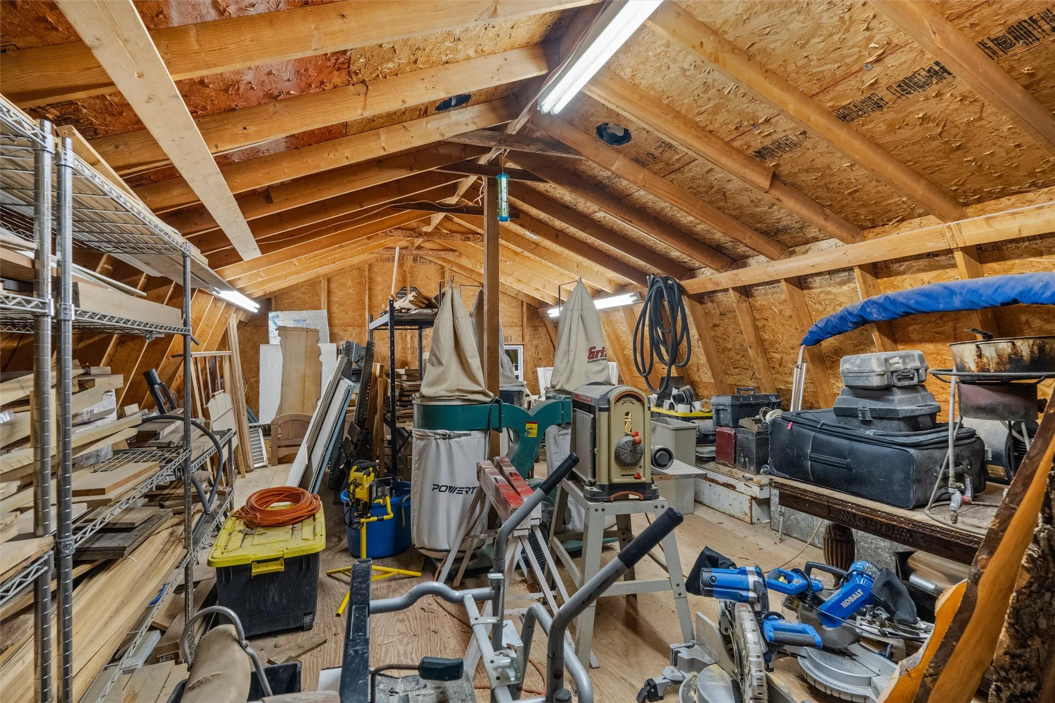 Loft area in workshop provides plenty of room for storage.