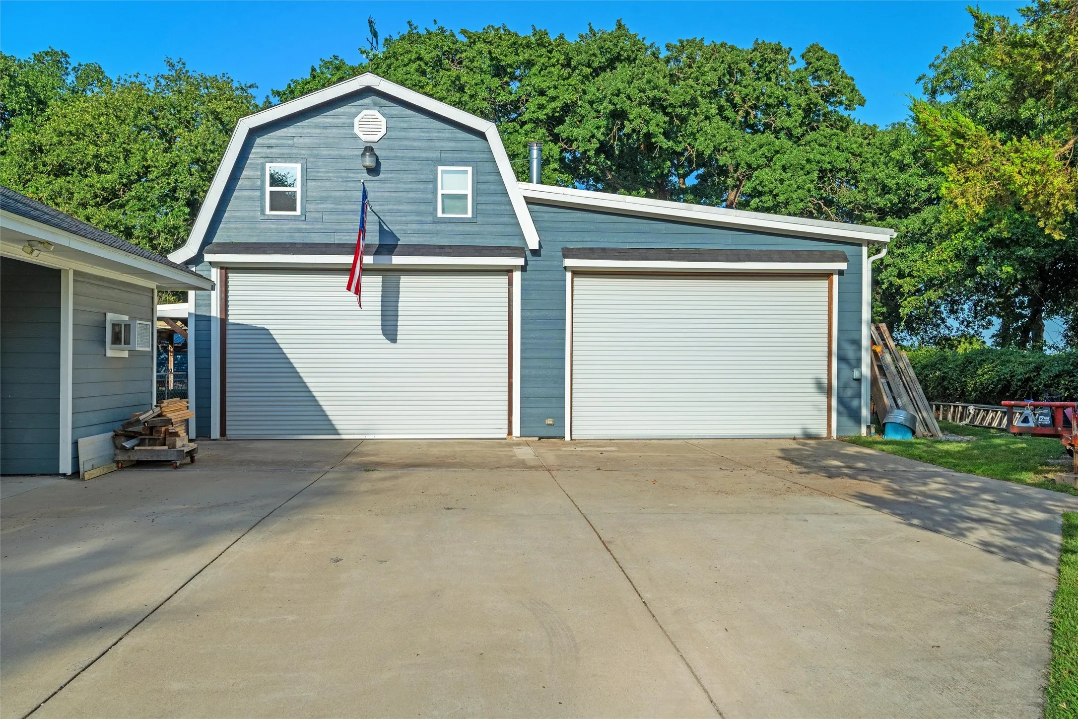 Double-bay workshop featuring a gambrel roofline