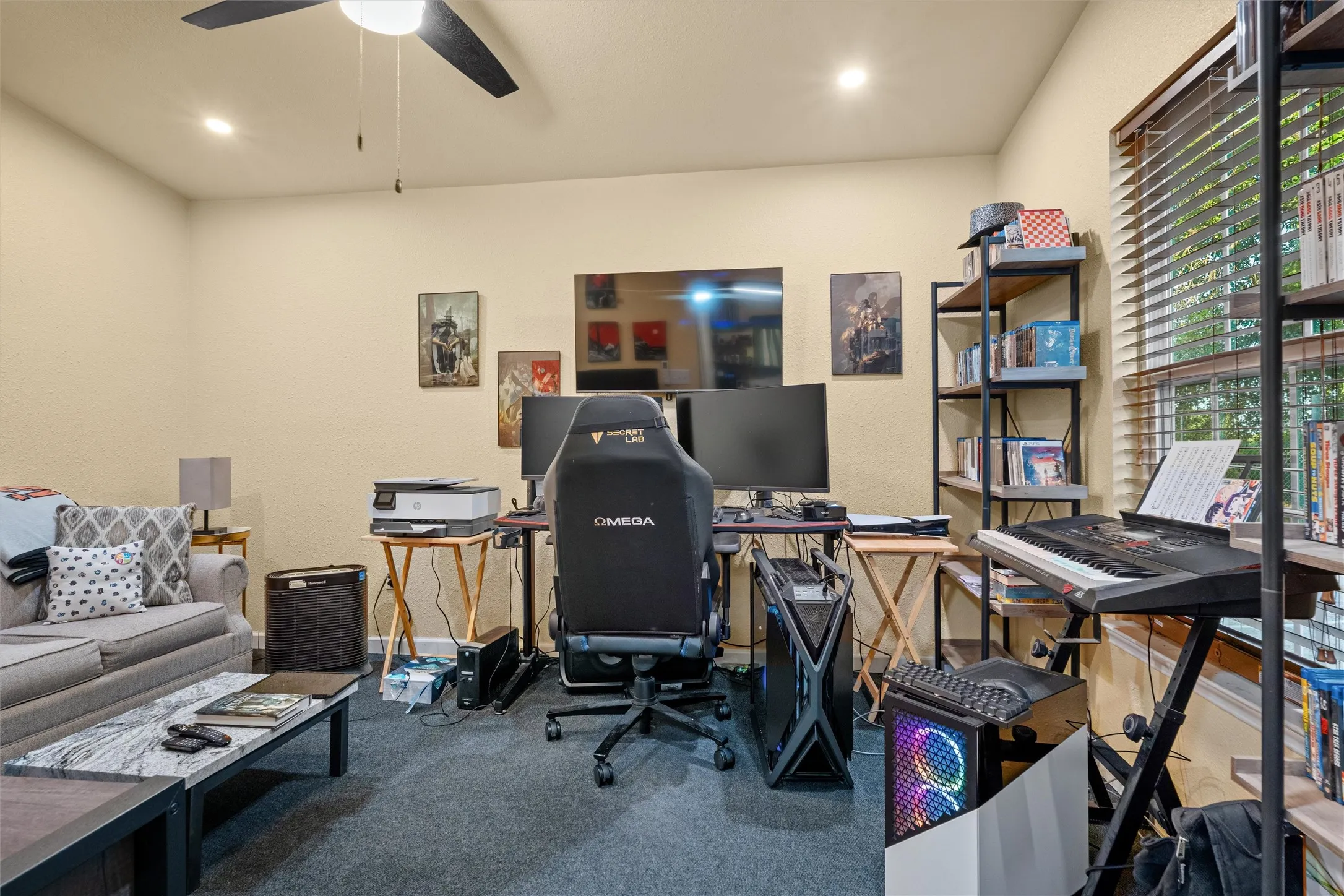 Versatile room featuring recessed lighting, a ceiling fan, textured walls, and carpet flooring