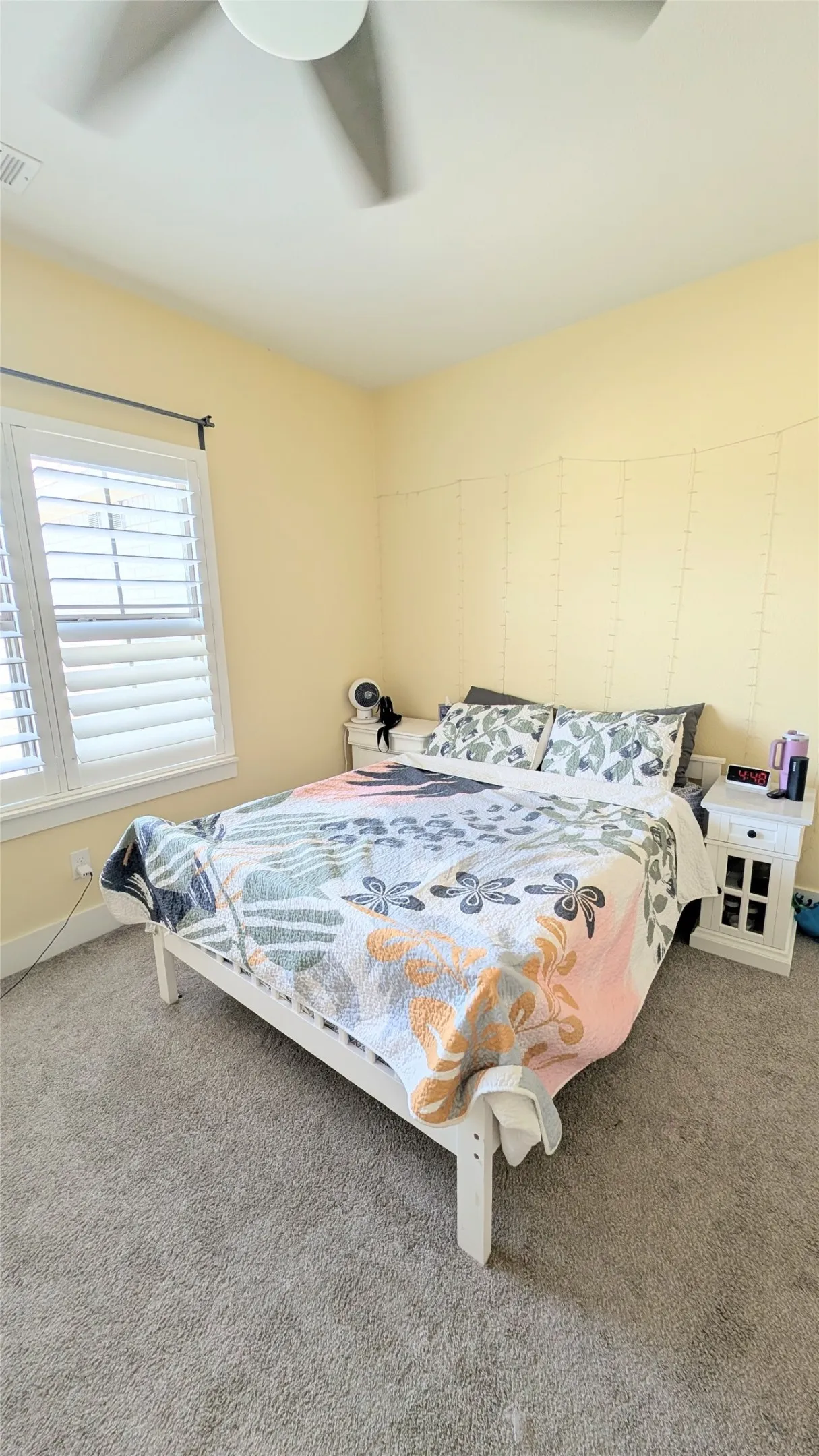 Bedroom featuring soft-hued walls and plush carpeting