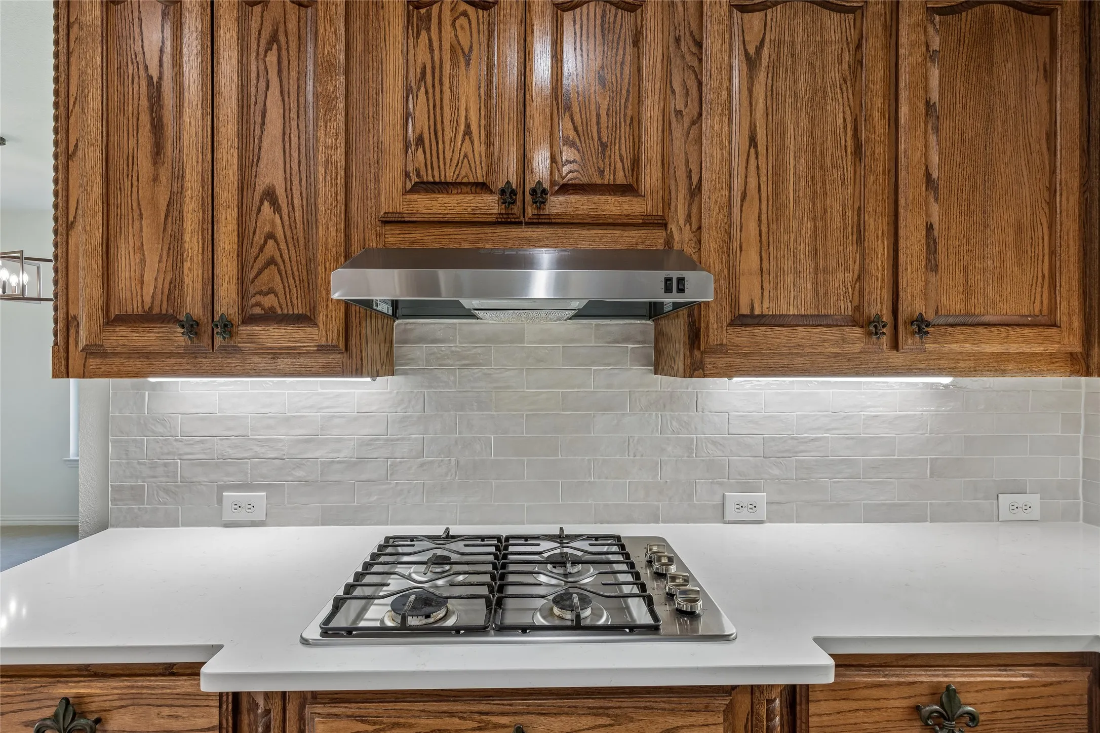 Updated backsplash and chef's gas cooktop