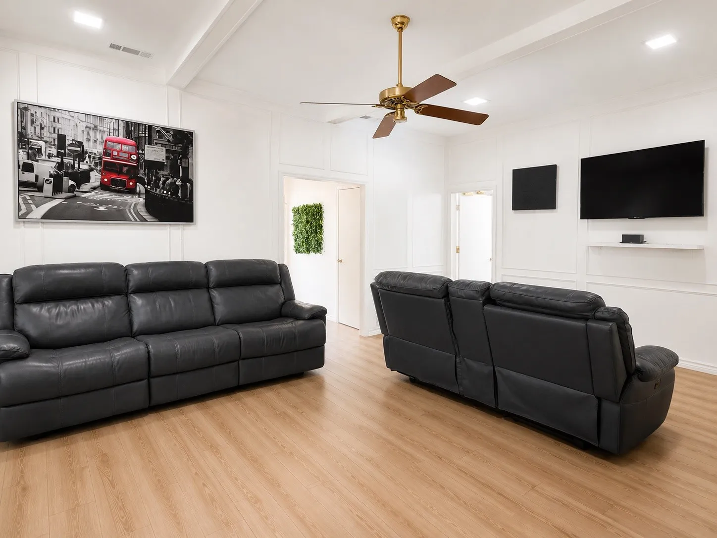 Spacious interior room featuring light wood-finish flooring