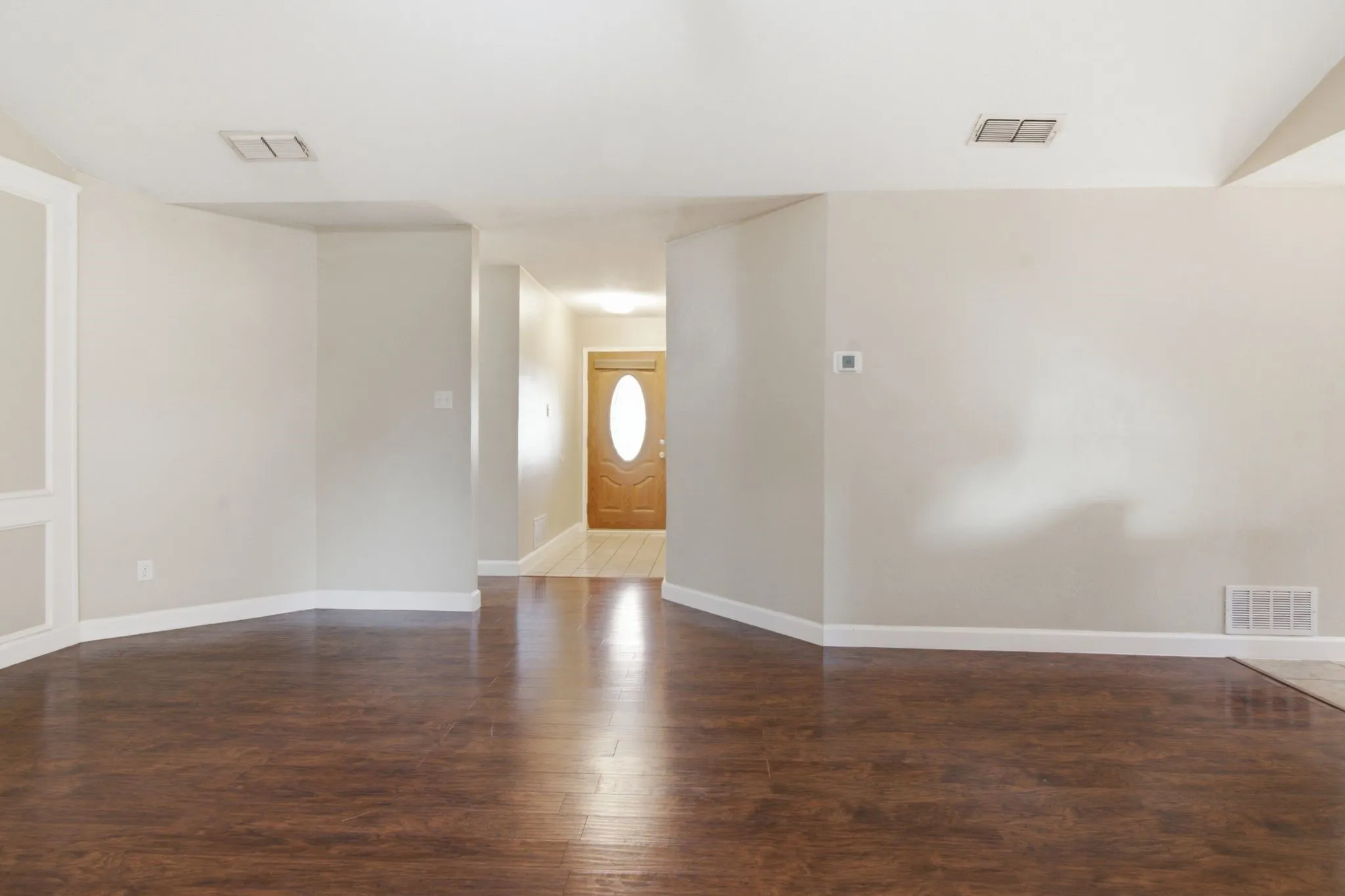 looking at the front door entry from the living room