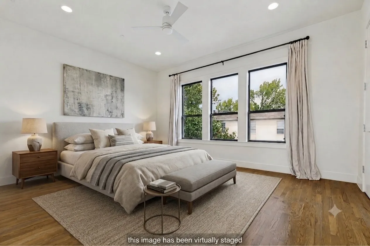 Room featuring wood-finish flooring, recessed lighting, and a ceiling fan