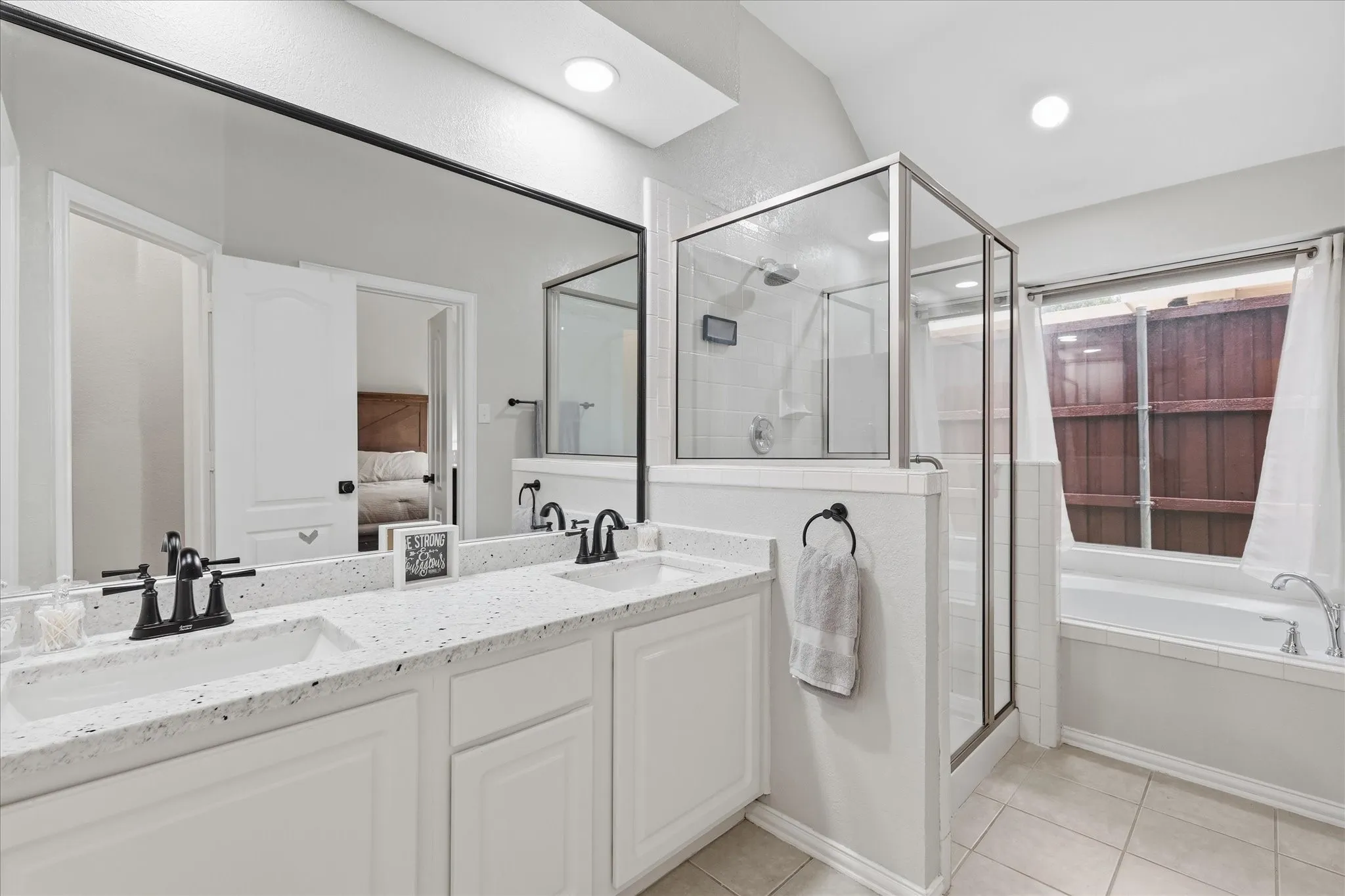 Primary bathroom with walk in shower and garden jetted tub.