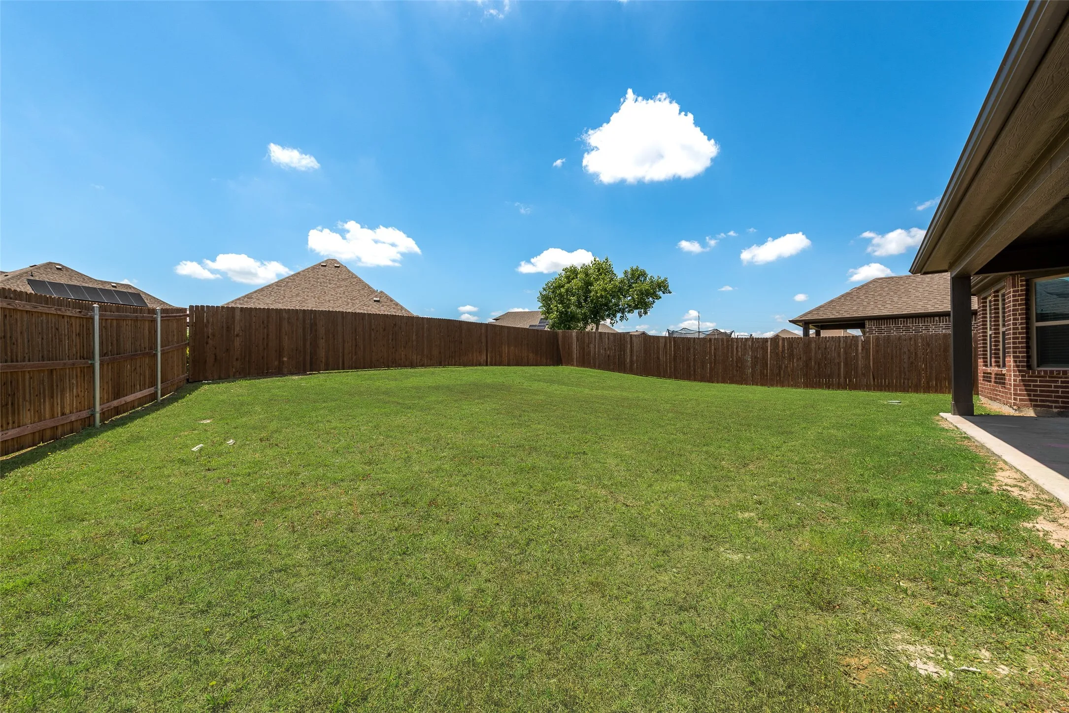 View of fenced backyard