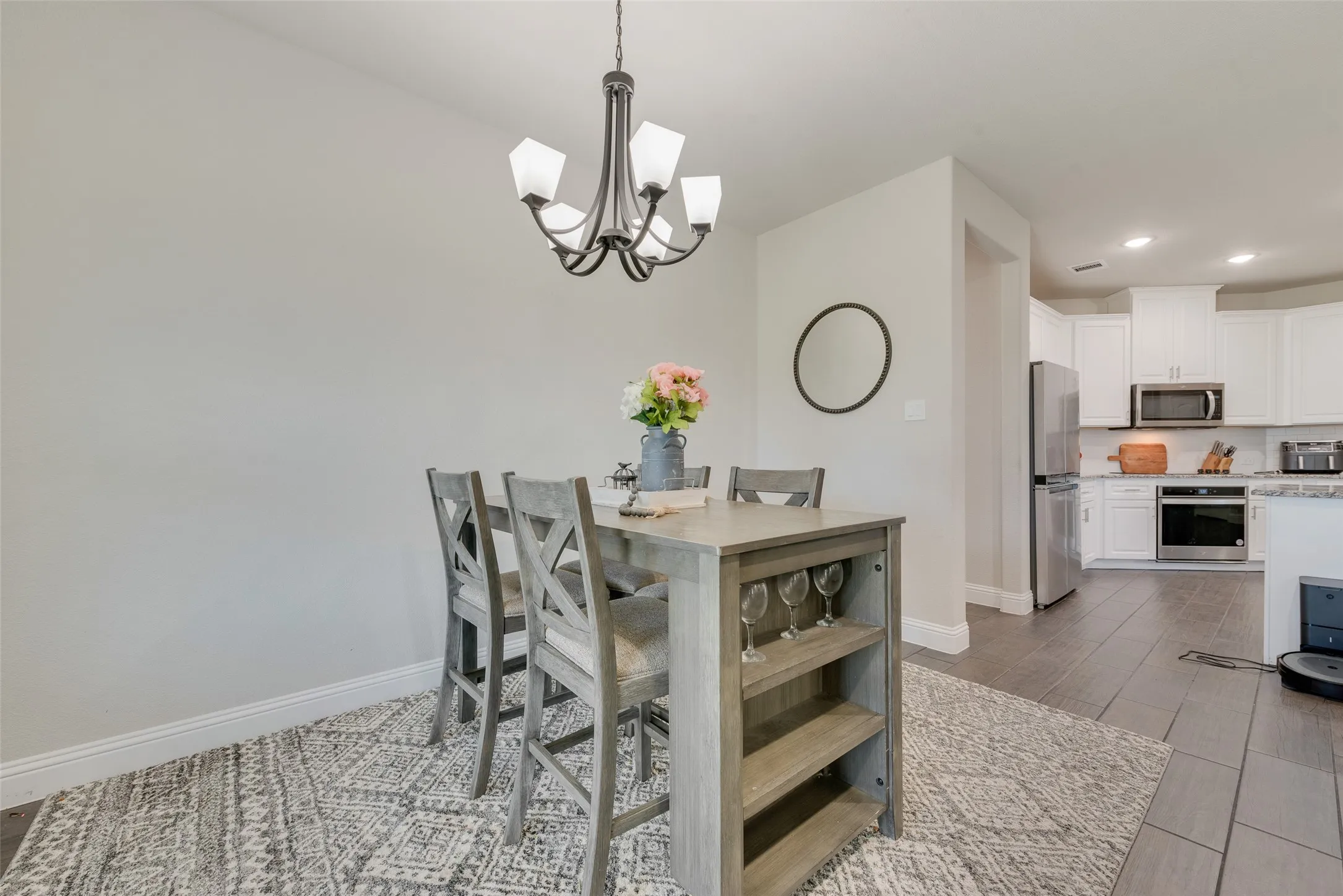 Dining room with a chandelier, recessed lighting, and wood finished floors