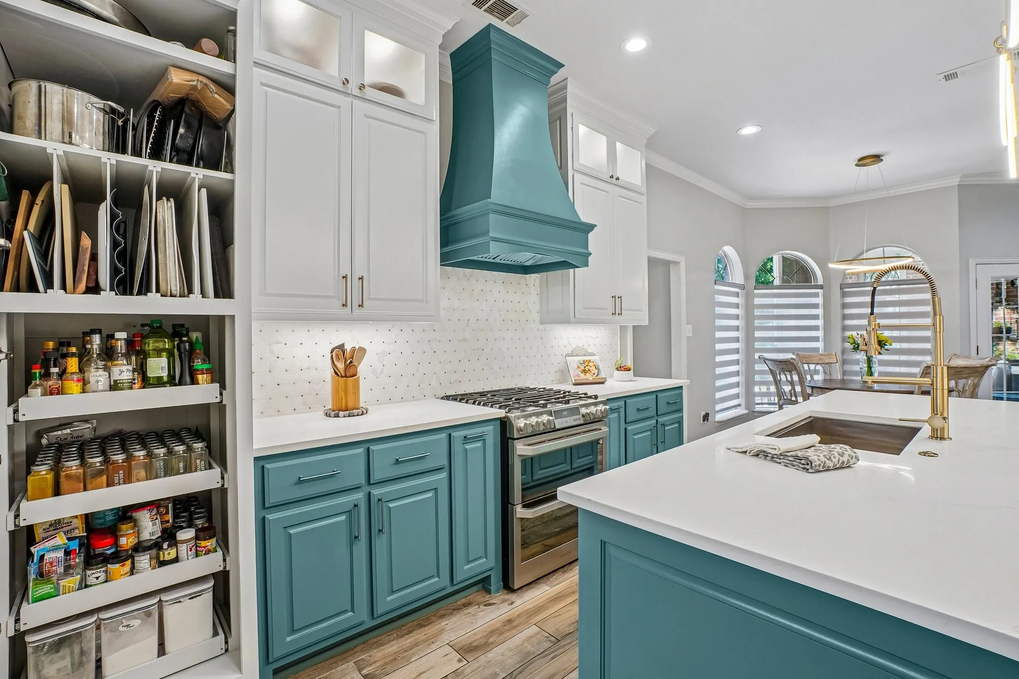 Custom updated cabinetry featuring underlighting and upper lighting