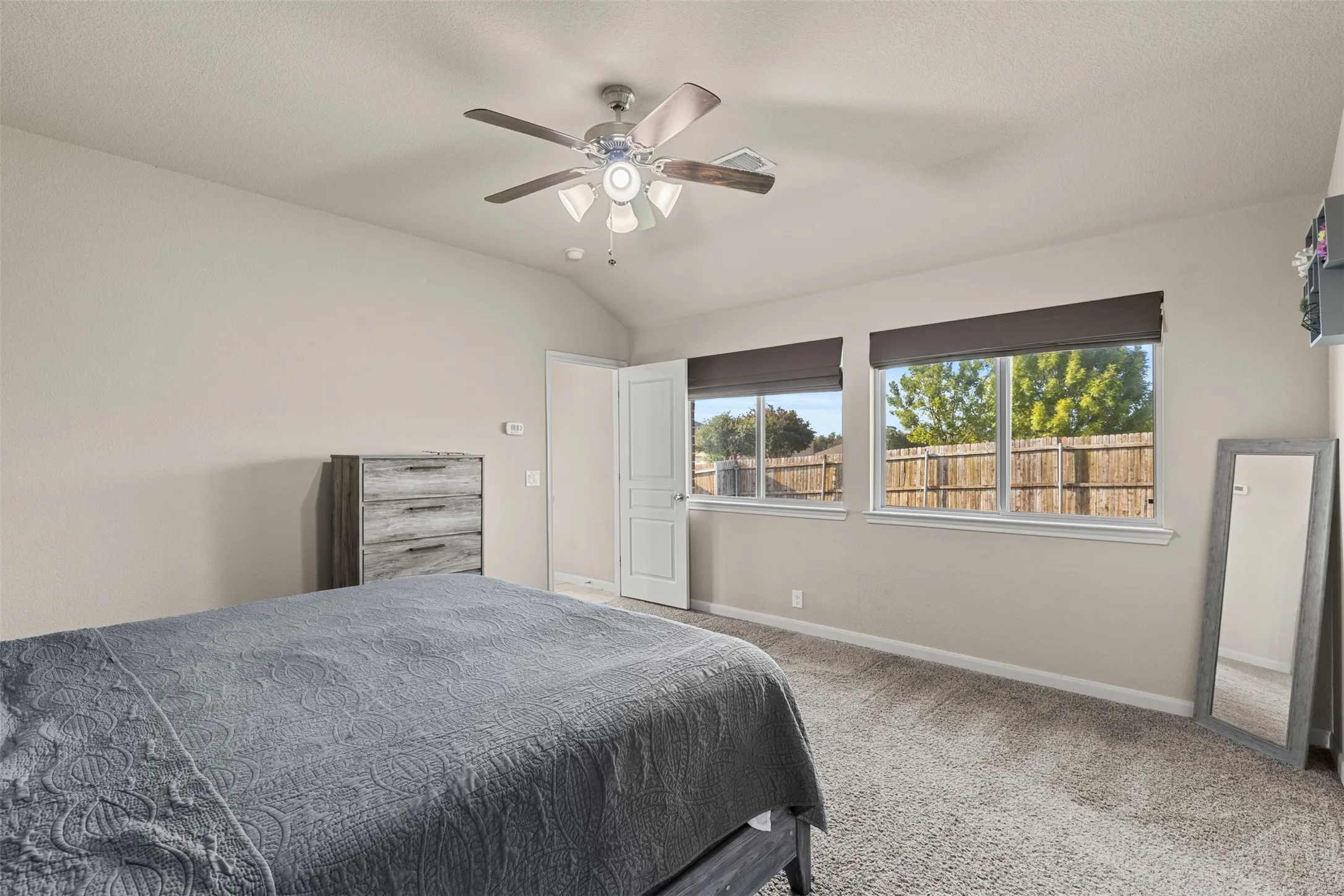 Primary is at the back of the house, separate from all other bedrooms