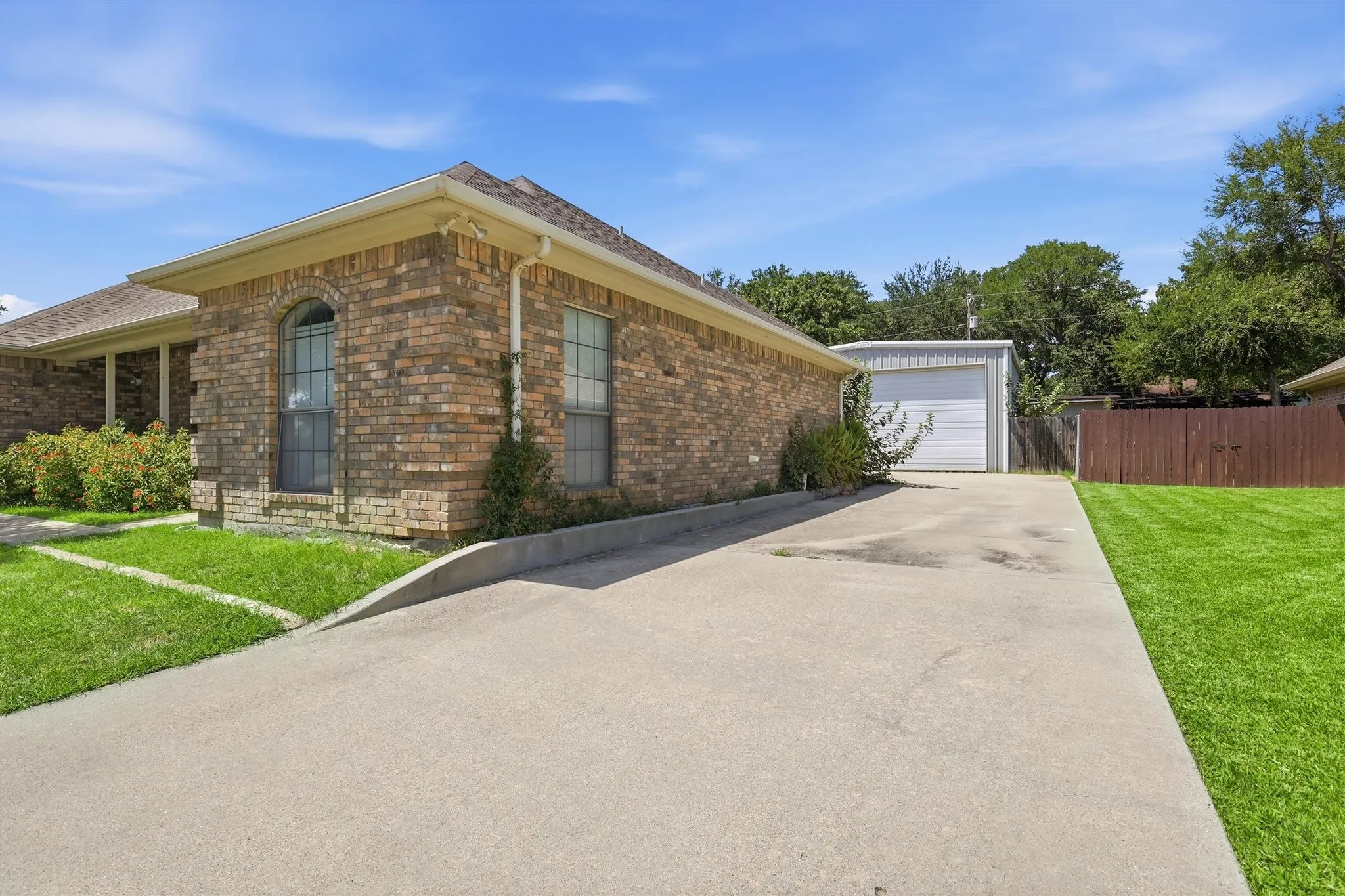 Separate drive for RV or entrance to shop.