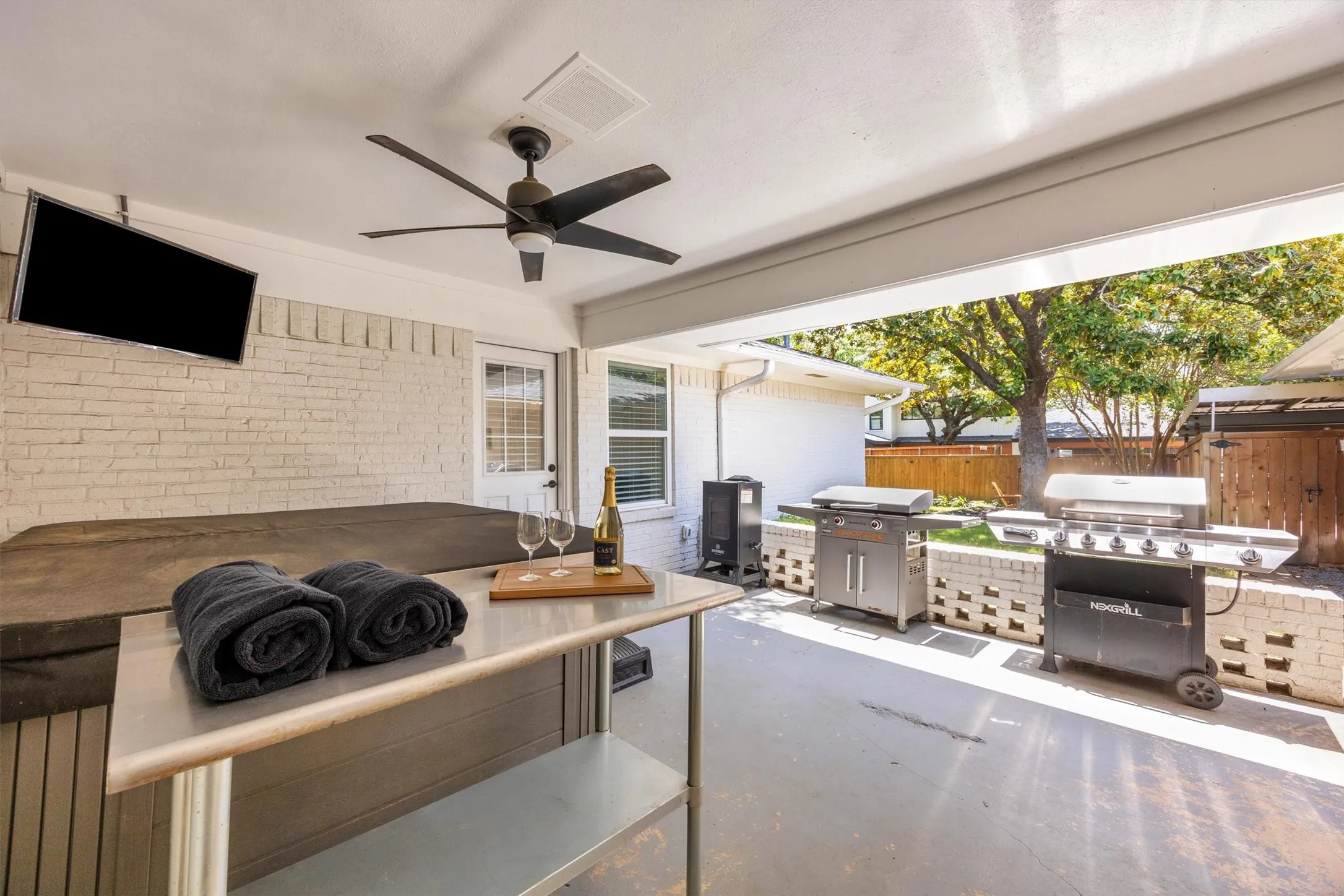 Covered patio with hot tub