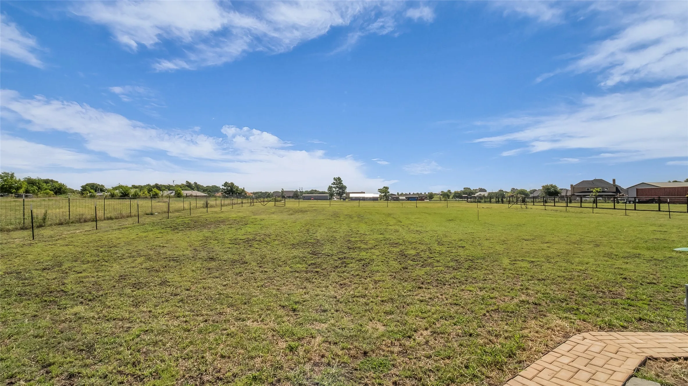 One Acre grassy yard with perimeter fencing