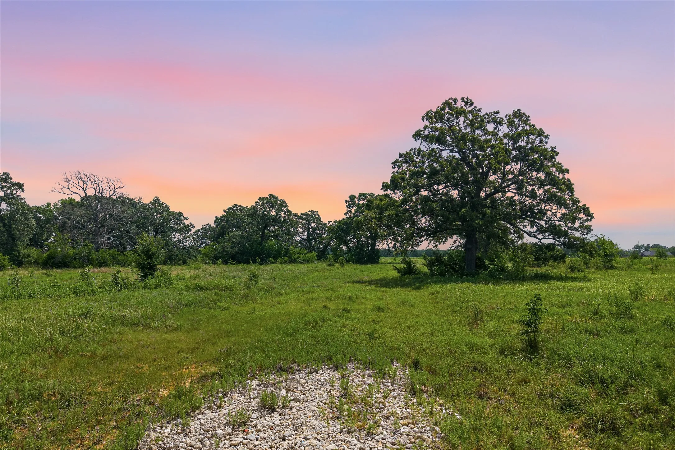 Property entrance off CR 2610 at sunset