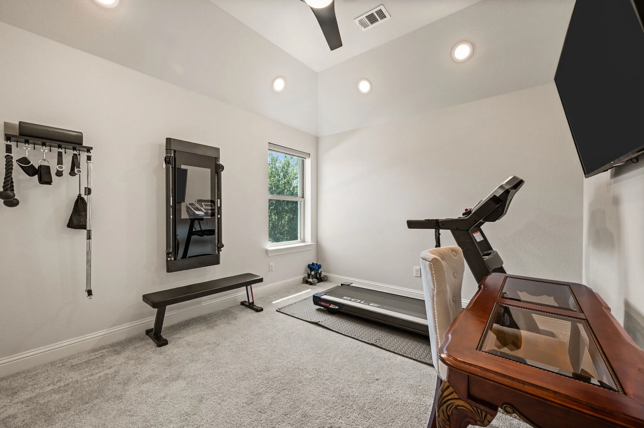 One of three upstairs bedrooms is currently used for exercise; Decorative Fan-light; Closet in this room is BIG