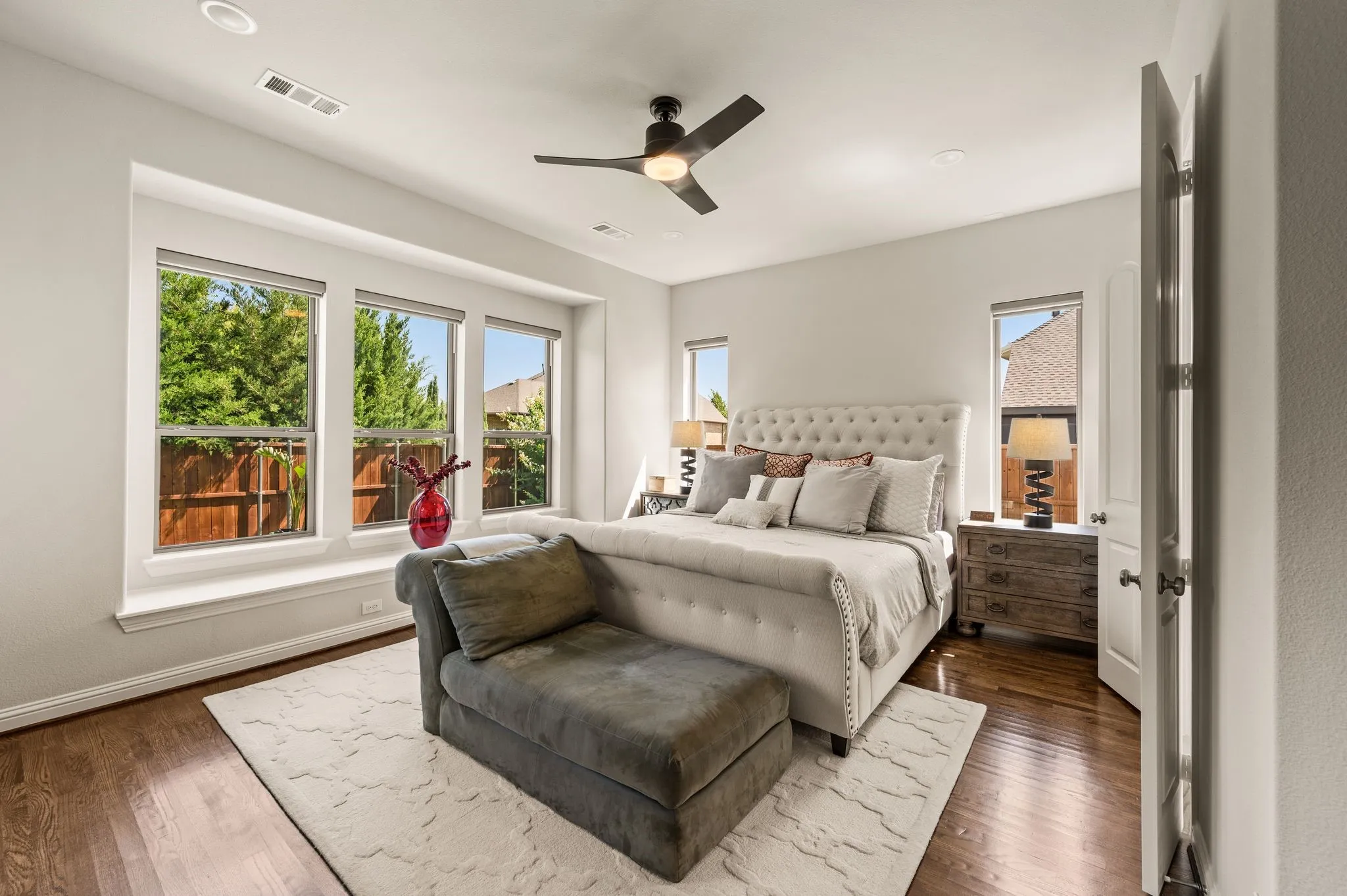 Wood floors flow into the primary; Window seat; Gorgeous natural light; Private views to the backyard