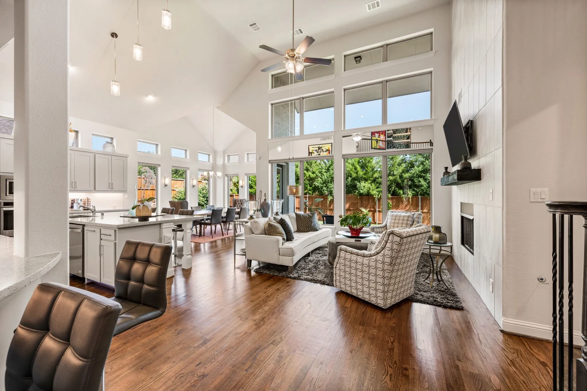 Views from the heart of the home are exceptionally private; Vaulted ceilings are on both levels; The attached mirrors between lower and middle windows convey