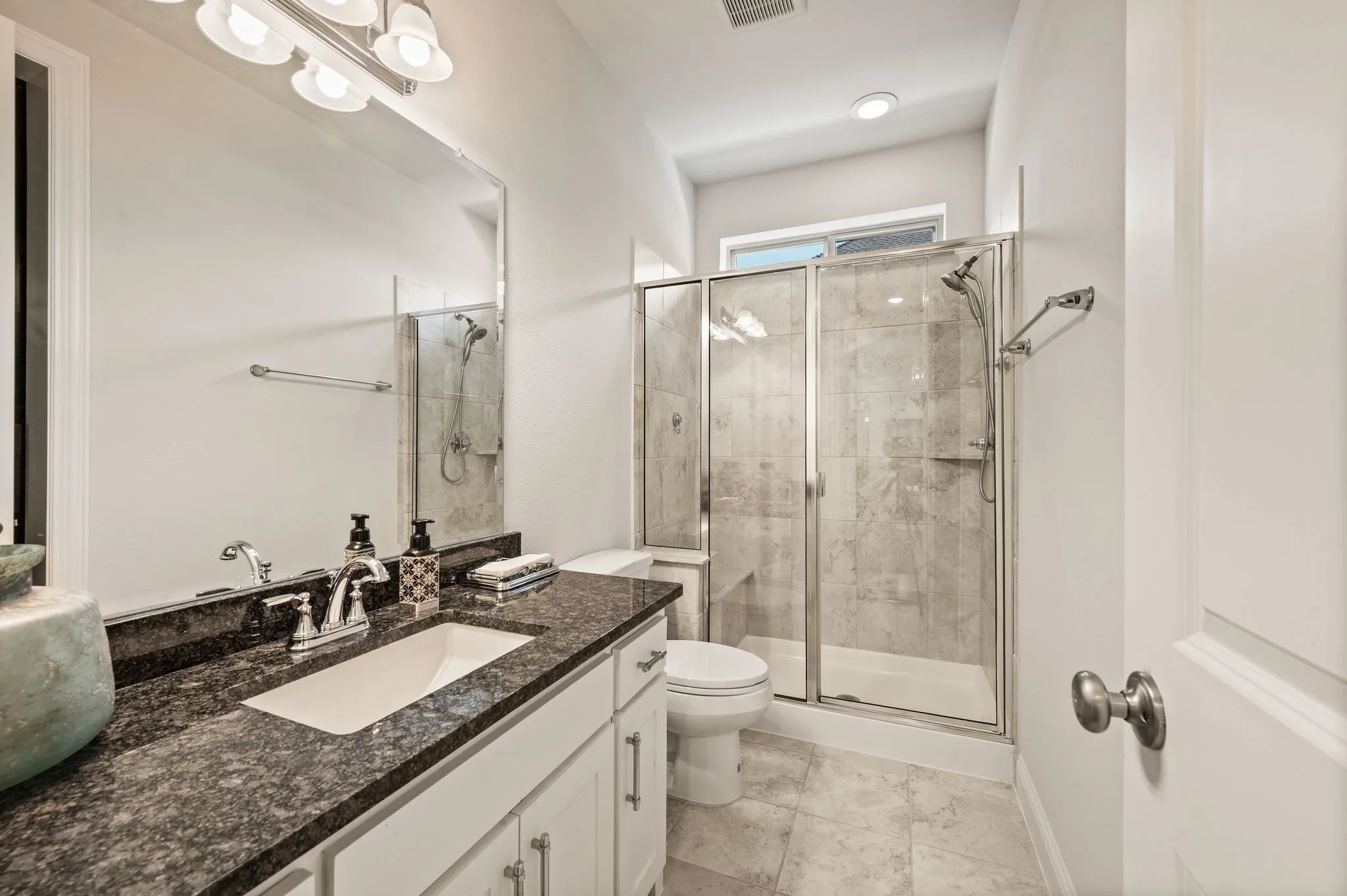 Full bath accommodates nearby Family, Guest or In-law suite AND friends who want to shower after a dip in the future pool; Granite countertops