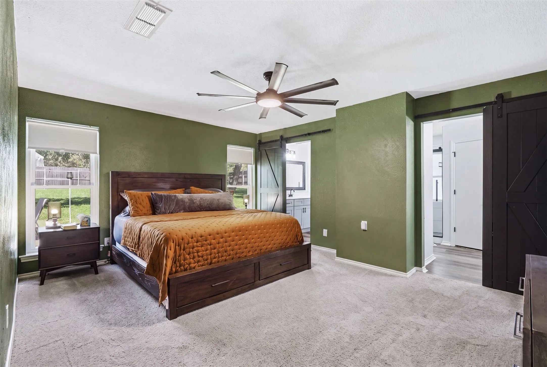Huge primary suite with 2 vanities and 2 walk-in closets.