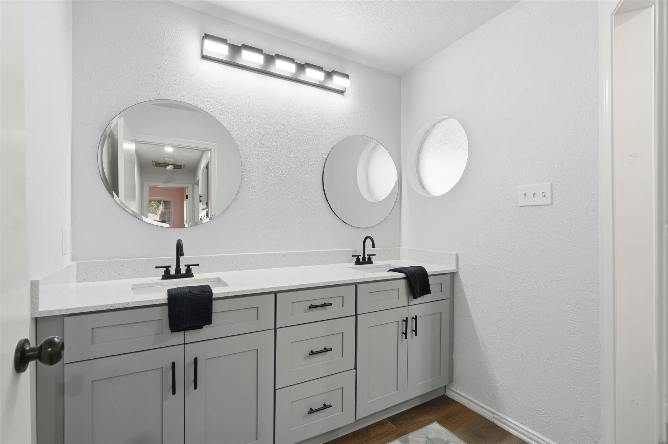 Dual vanities, private water closet and shower/tub
