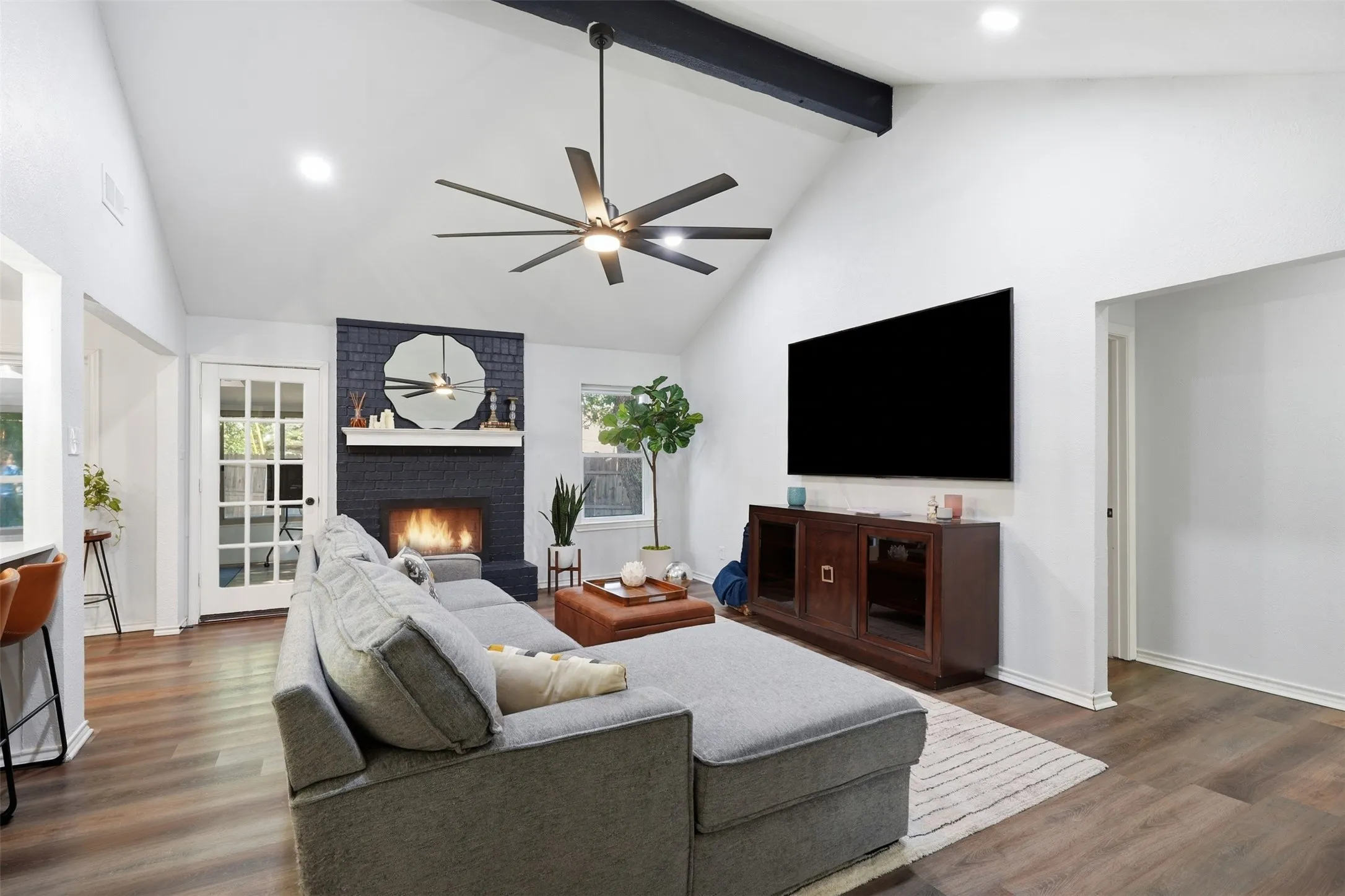 In the heart of the home, opens to kitchen and all bedrooms