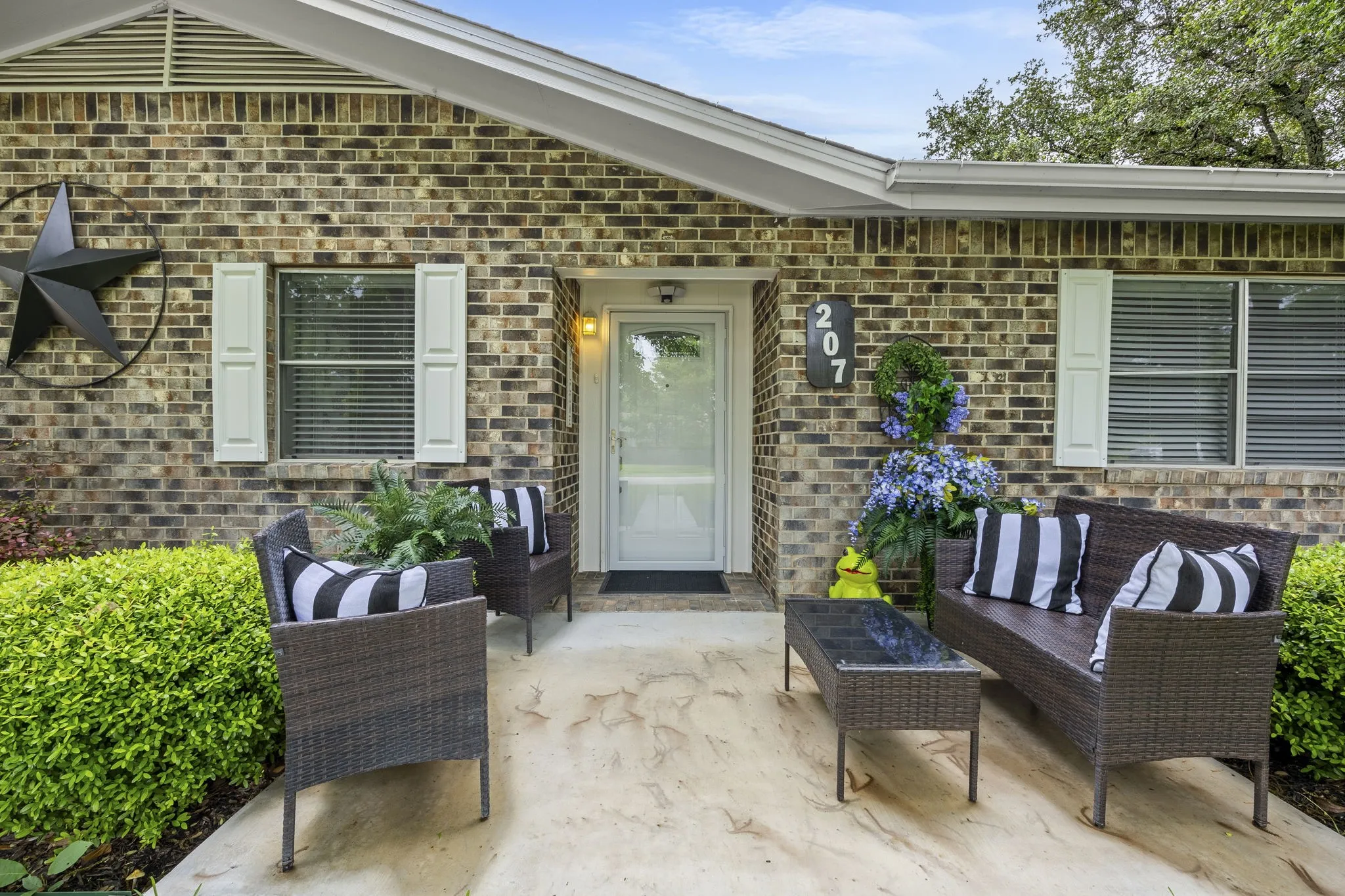 Inviting covered front porch with seating area