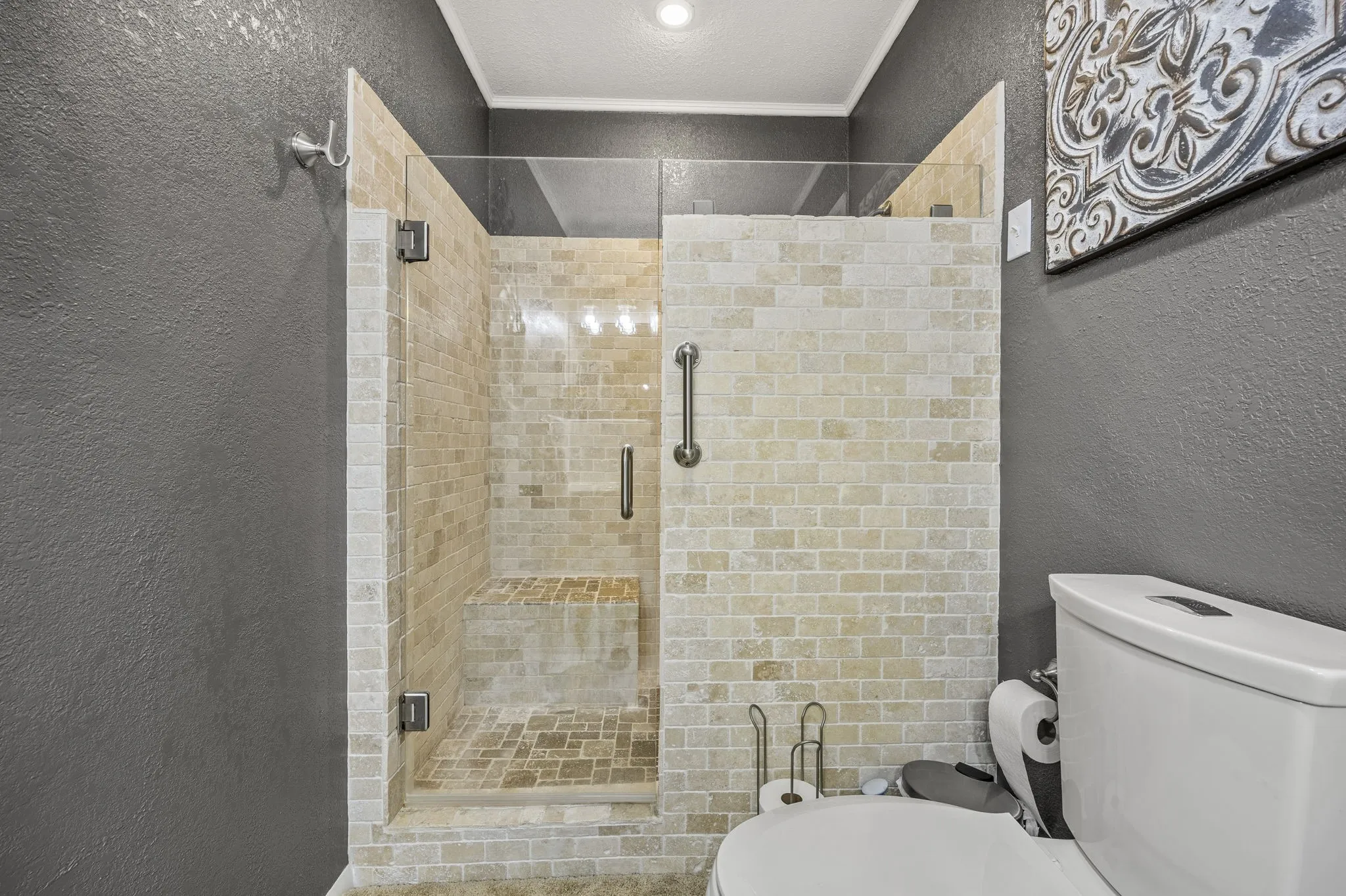 Lovely walk in tile shower with glass enclosure