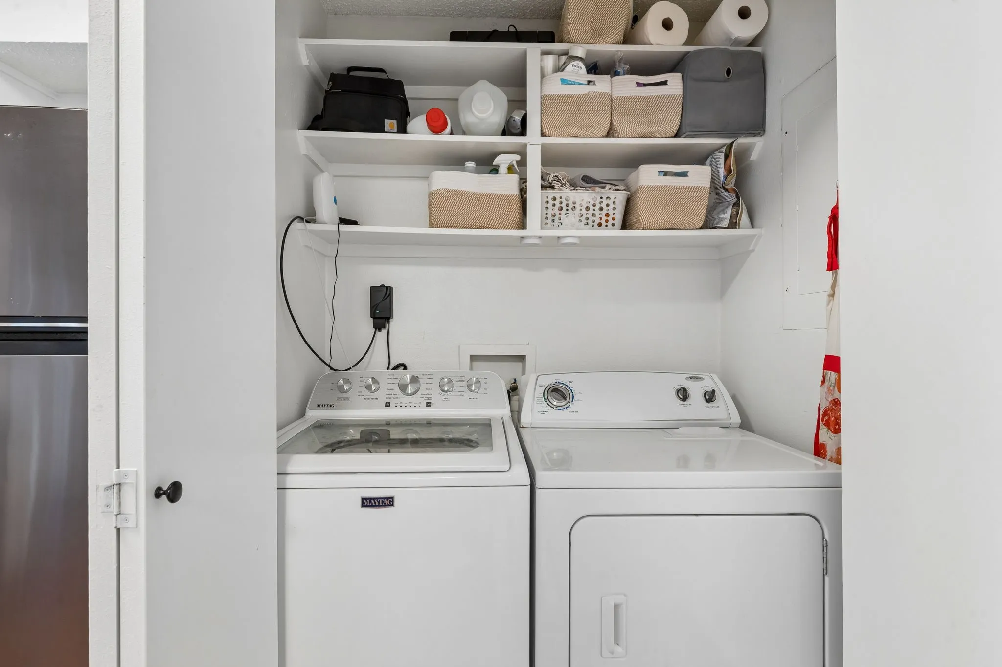 Utility Closet with great storage.