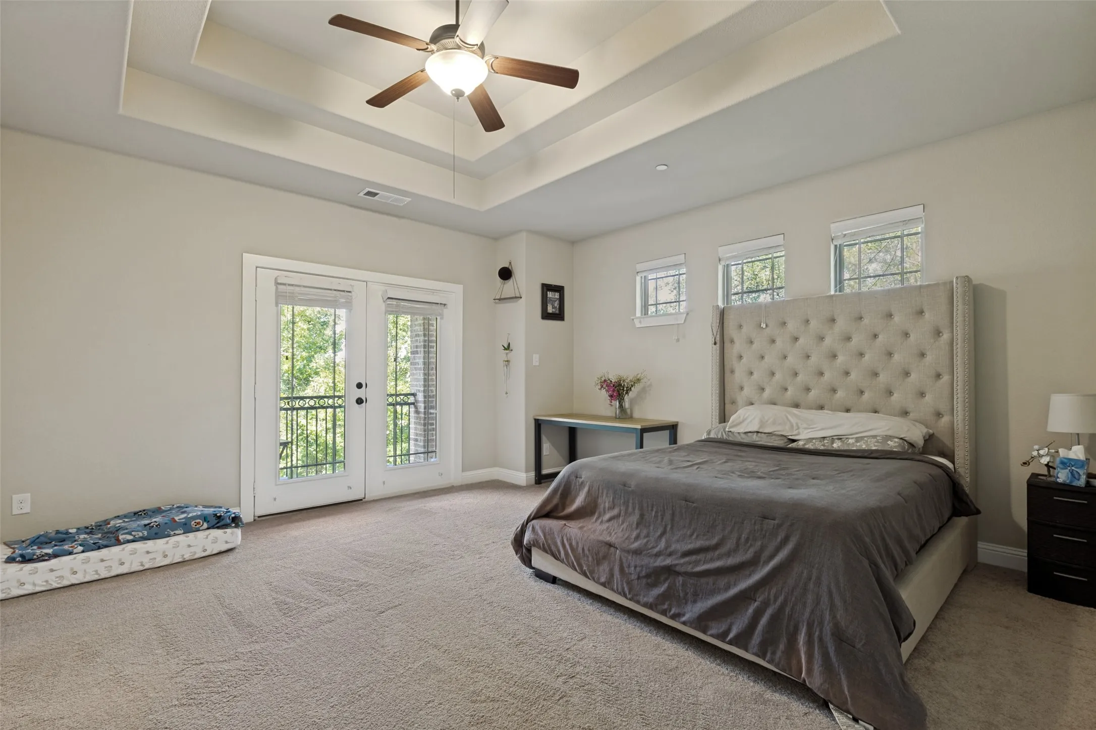 Large primary bedroom with esuite bathroom and balcony