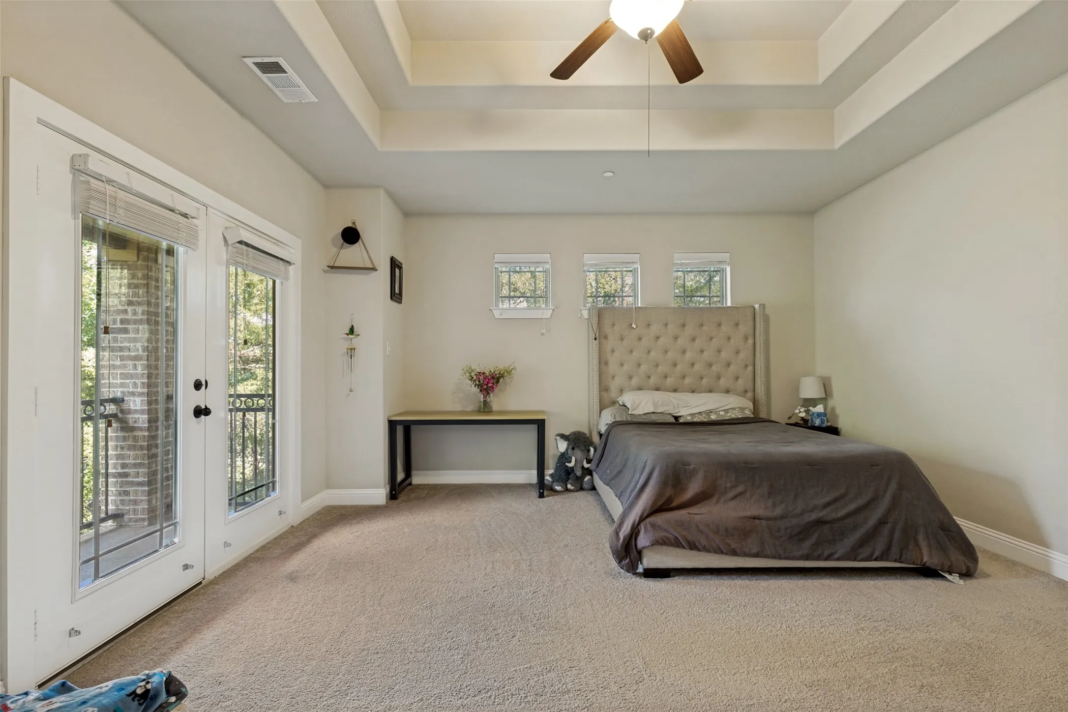 Large primary bedroom with esuite bathroom and balcony