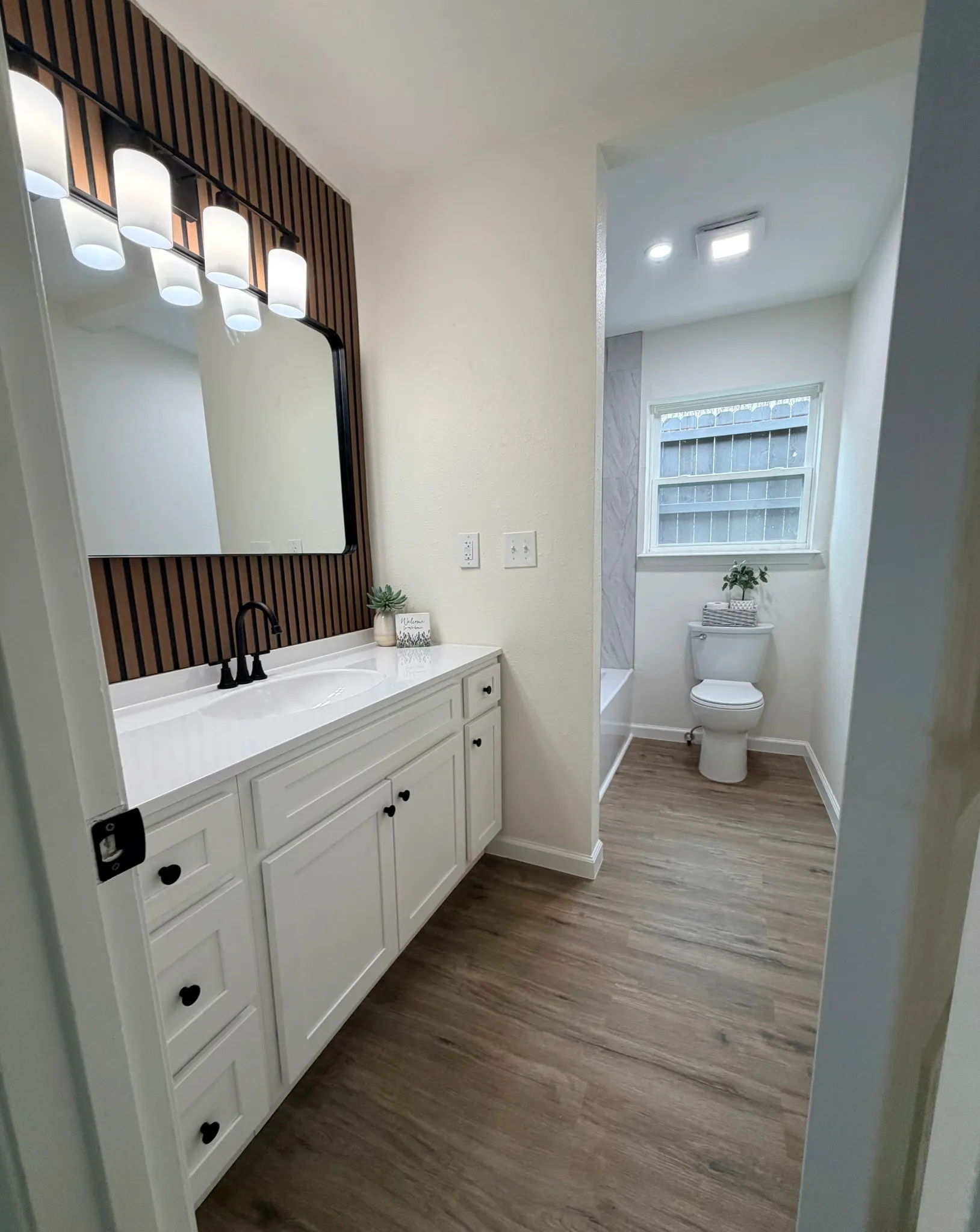 Guest bath is fully remodeled with custom touches.
