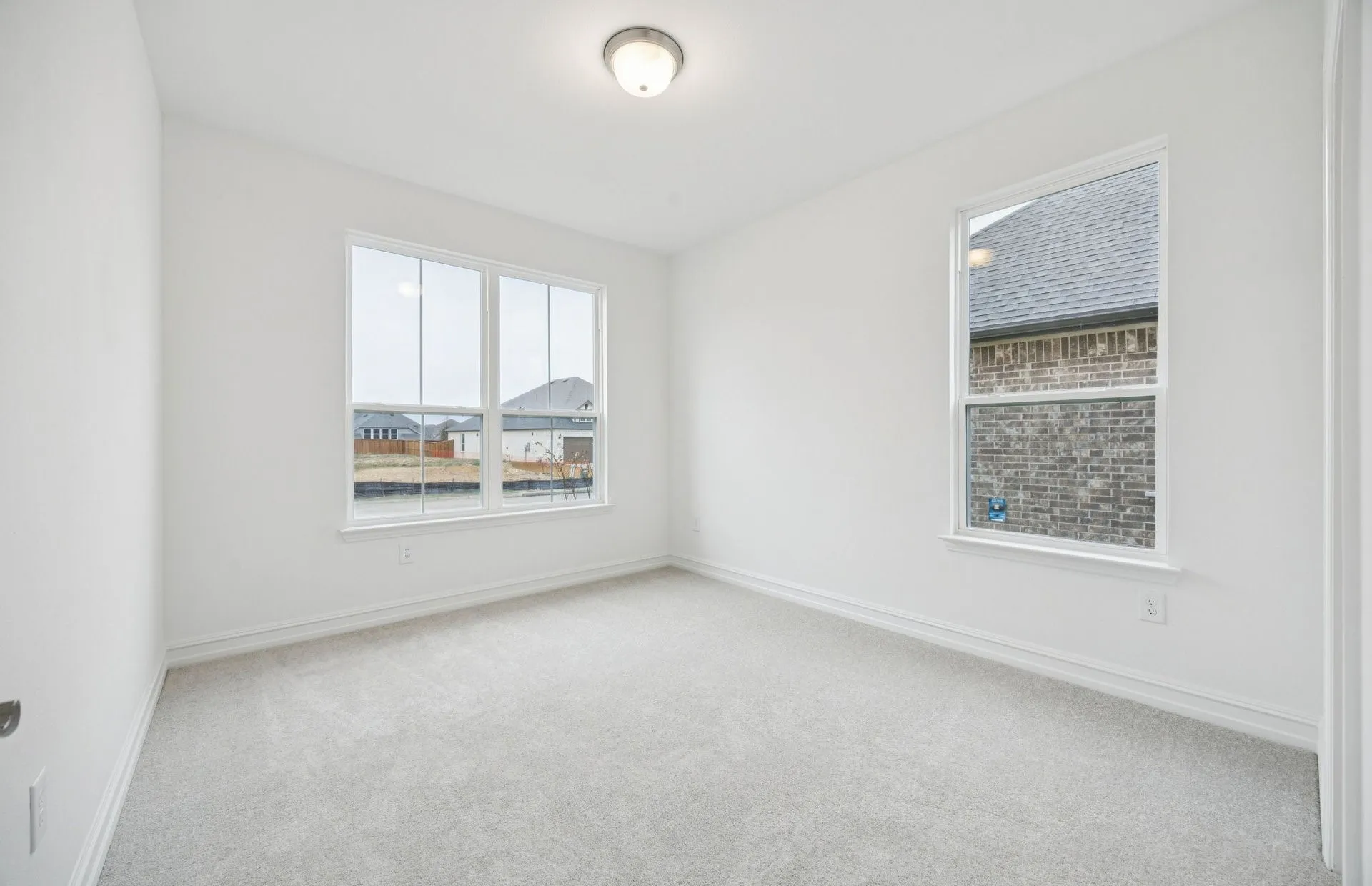 *Model Representation - Spacious secondary bedroom with large windows
