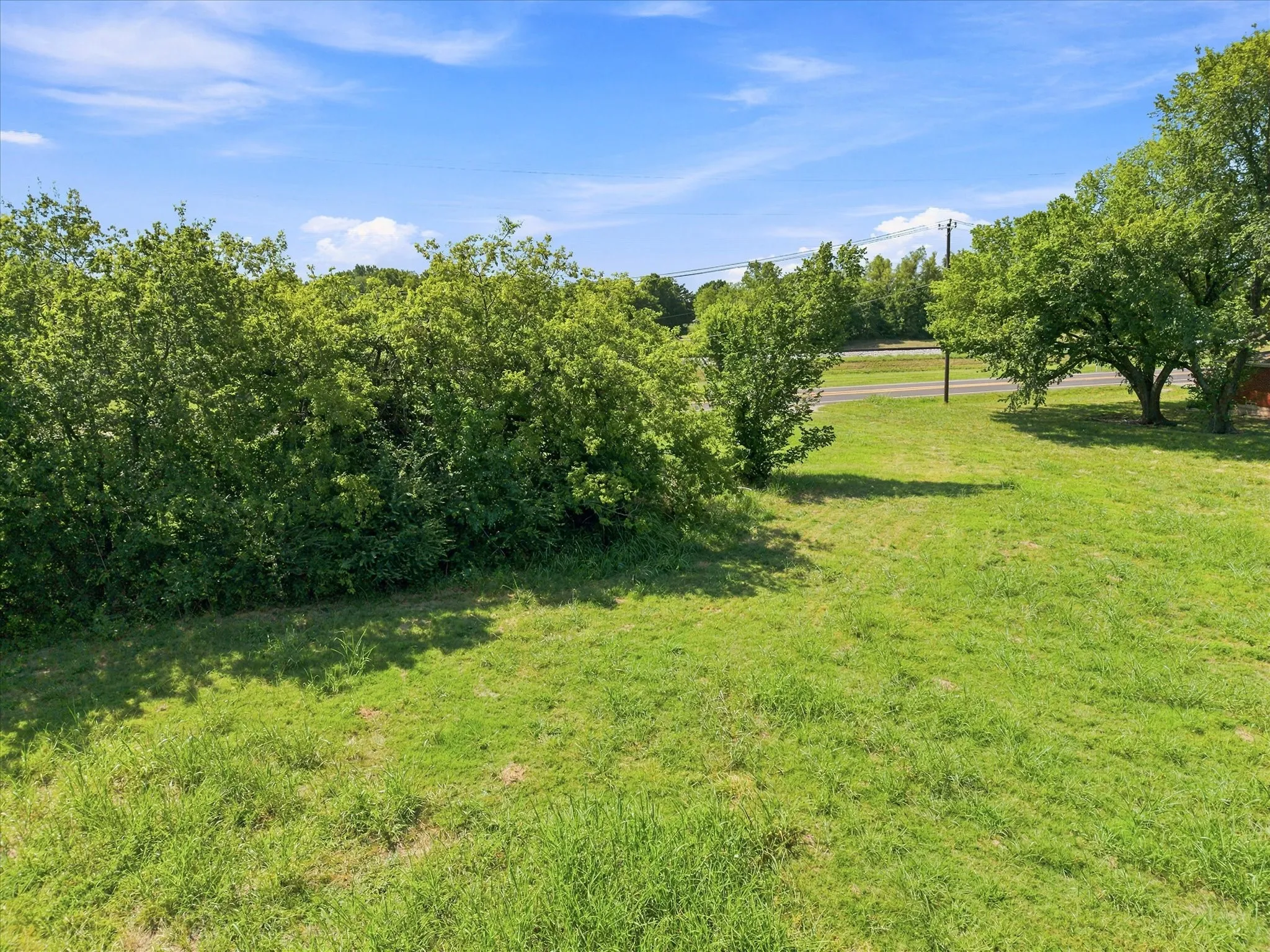 Tree lined lot is a plus!
