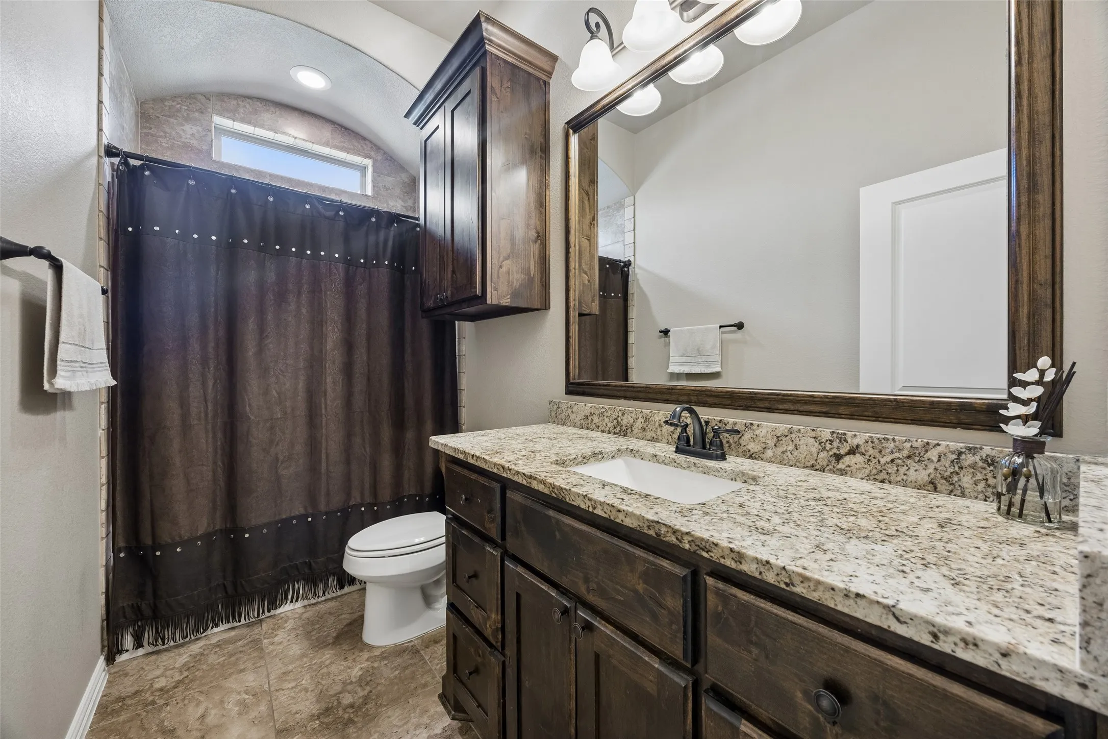 matching cabinetry and granite throughout the home