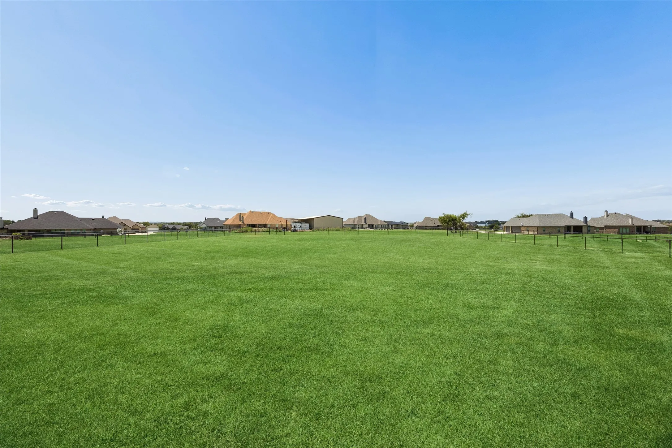 oversized acre lot with fencing