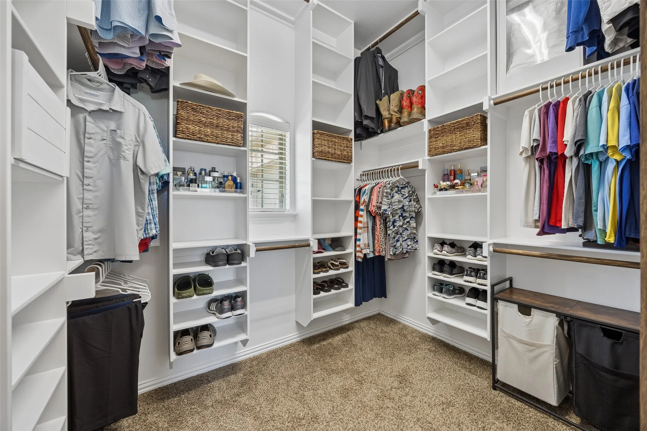 Custom cabinetry in the primary walk-in closet