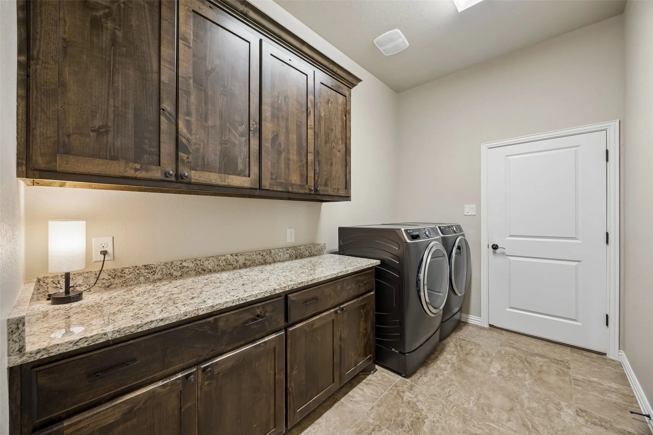Utility room with cabinetry and folding space