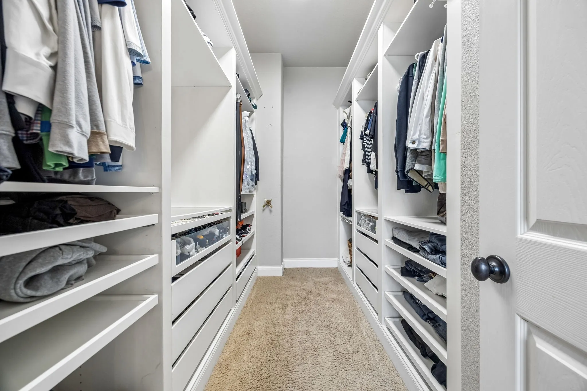 Custom closet design in primary bedroom